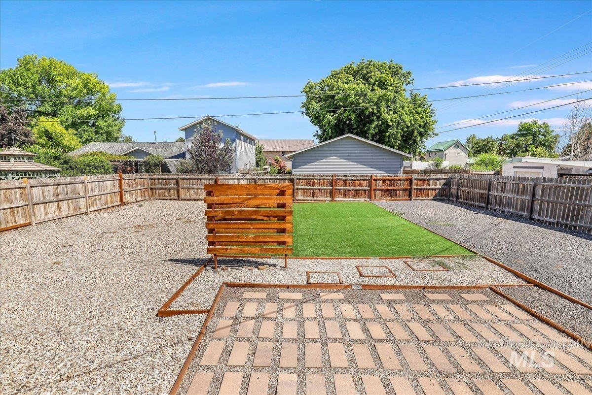 Fenced backyard featuring a patio area
