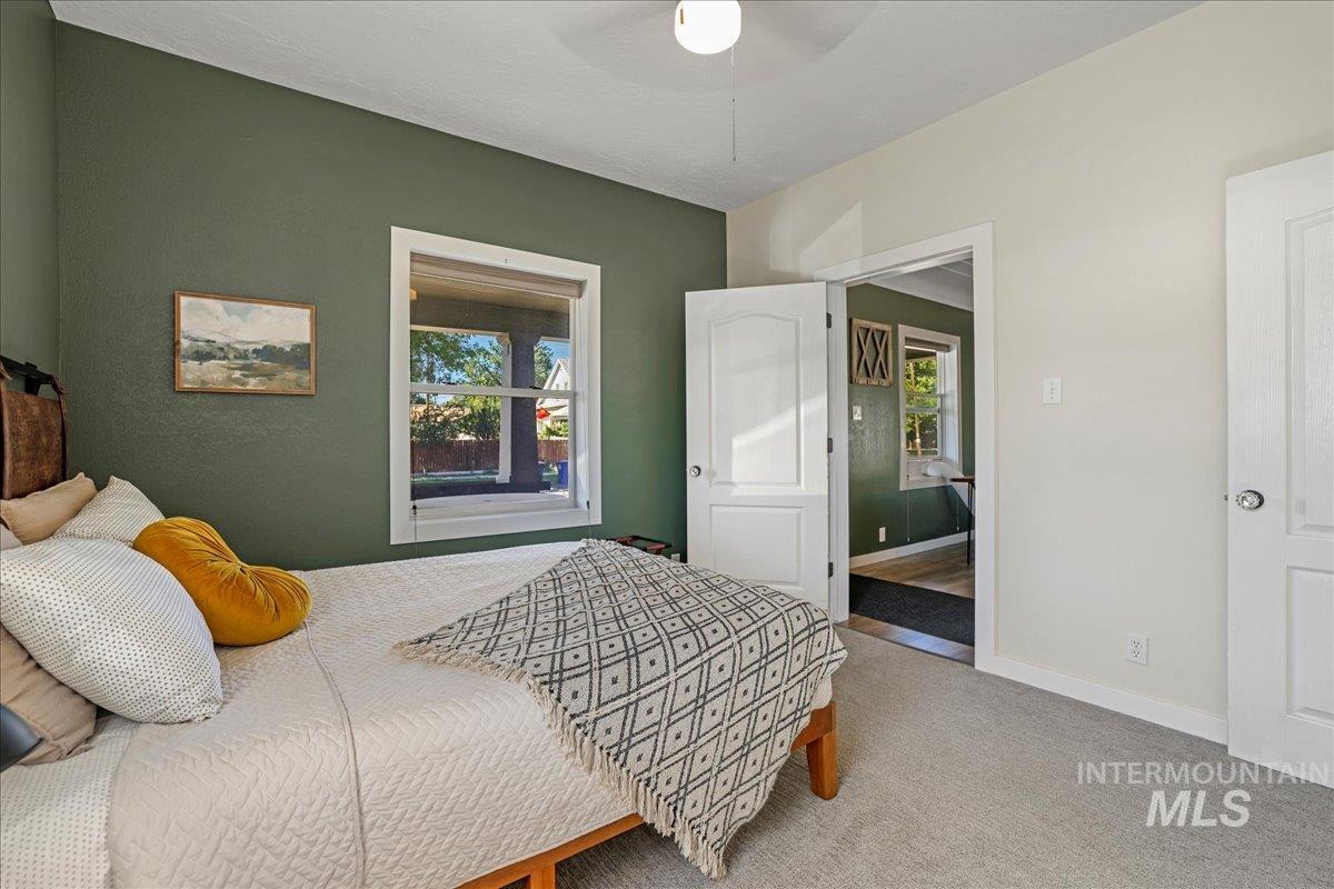 Bedroom featuring carpet flooring and a ceiling fan
