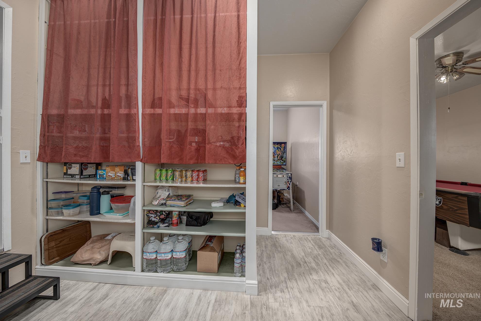 Interior space with light wood-type flooring and baseboards