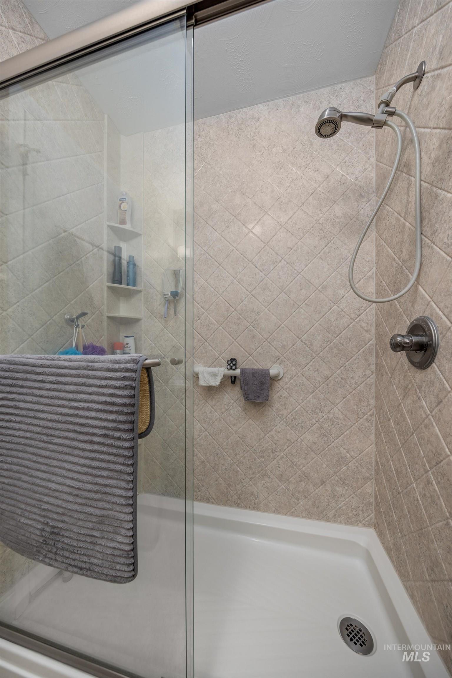 Full bath featuring a stall shower