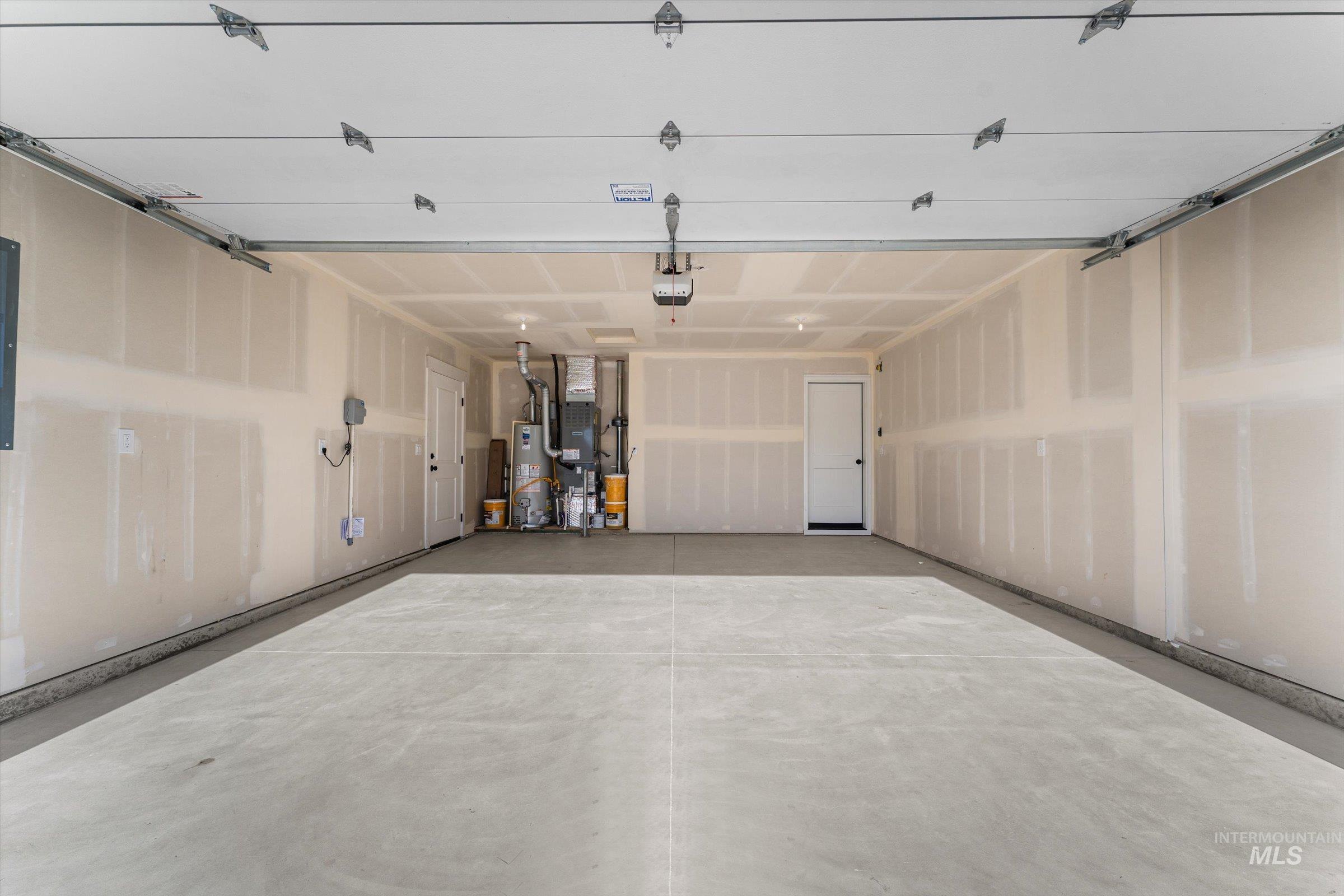 Garage featuring gas water heater