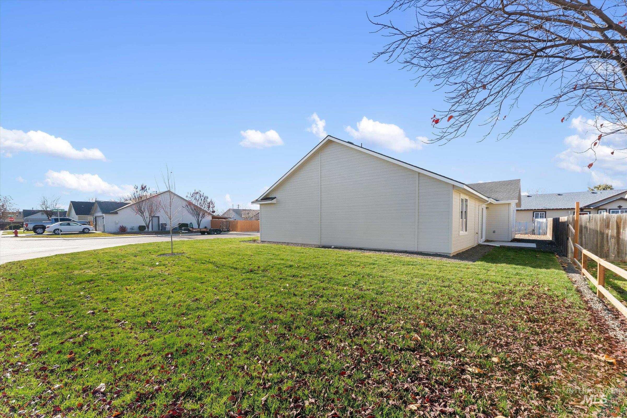 View of side of home featuring a fenced backyard