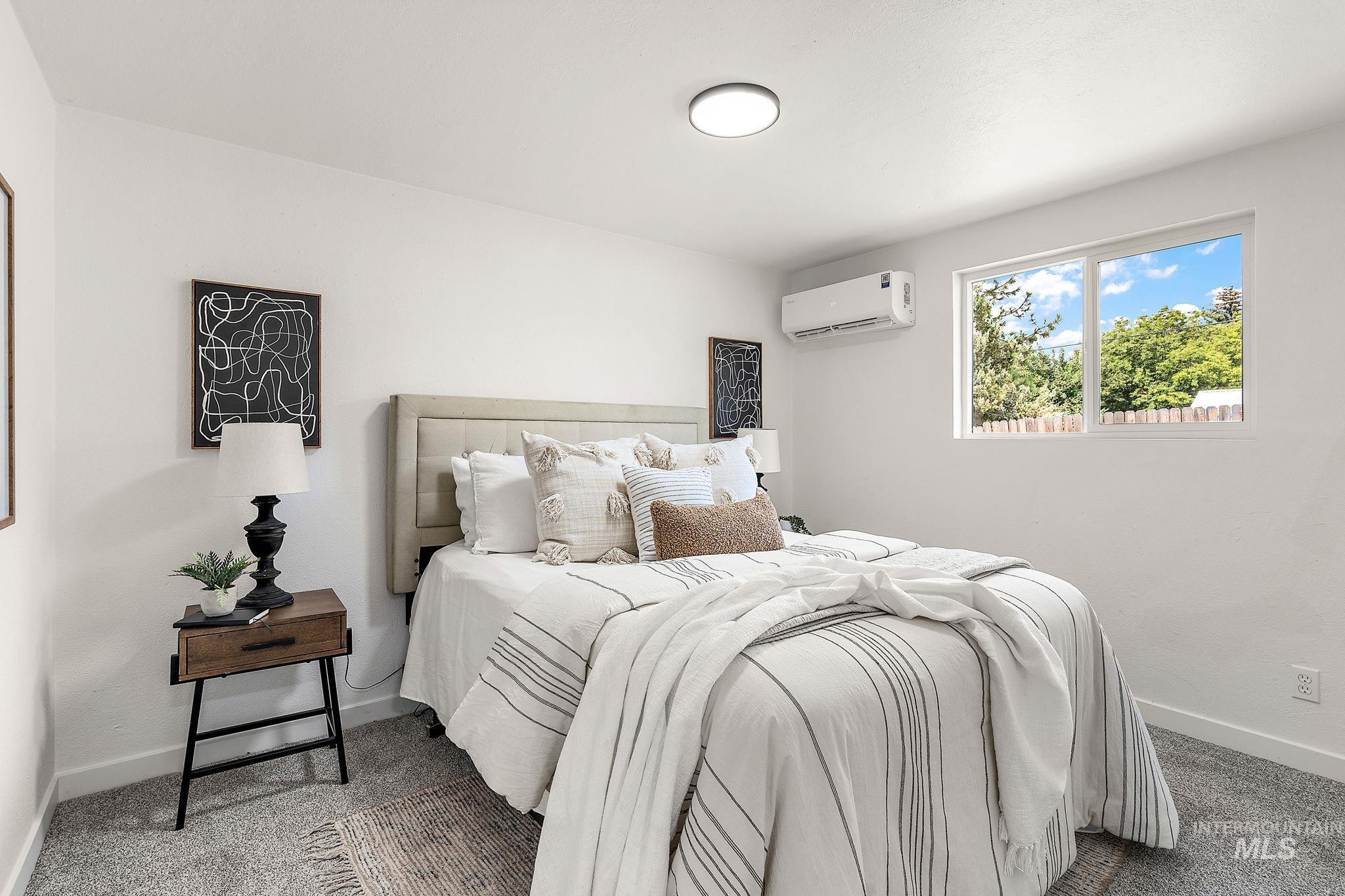 Carpeted bedroom with baseboards