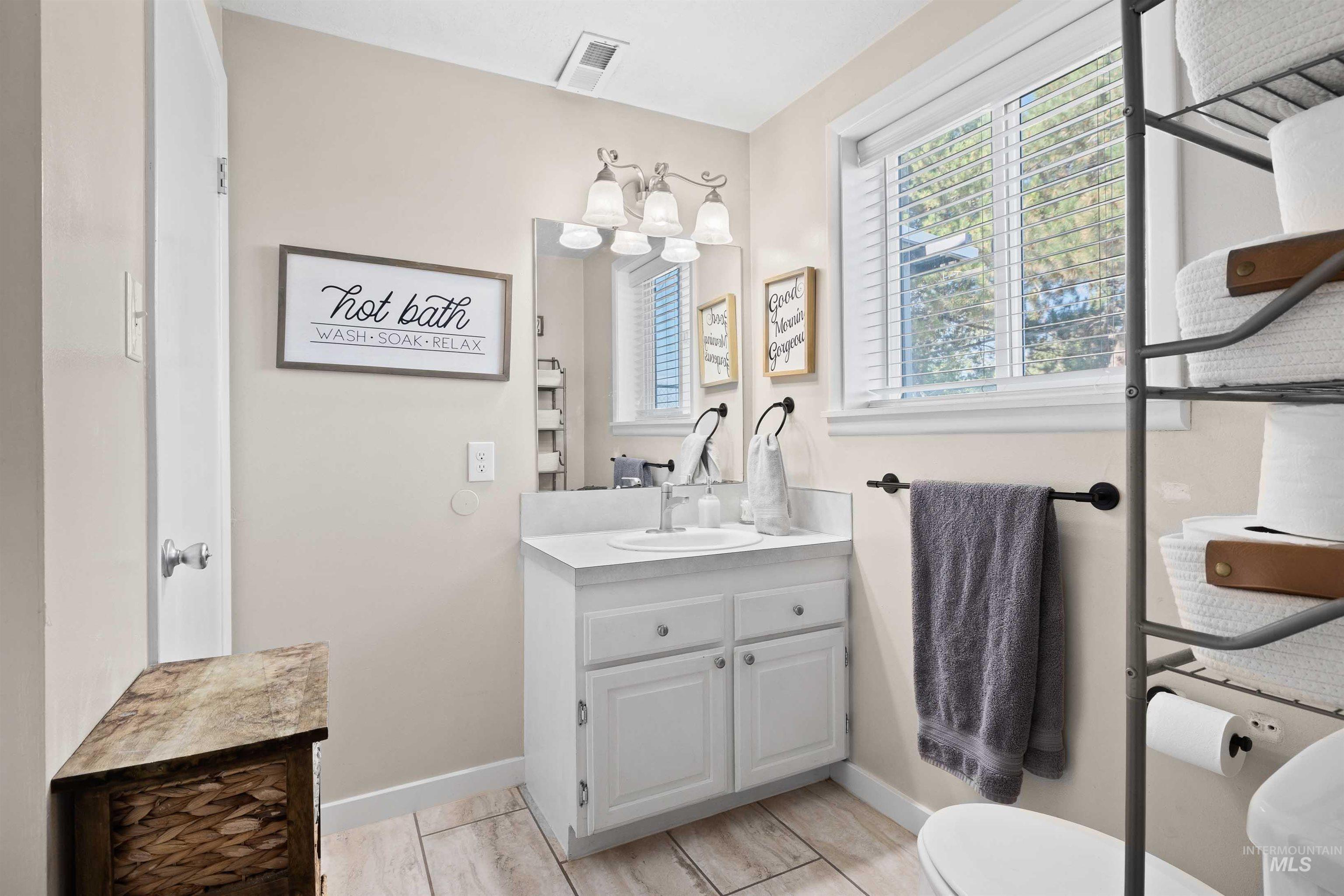 Bathroom with baseboards and vanity