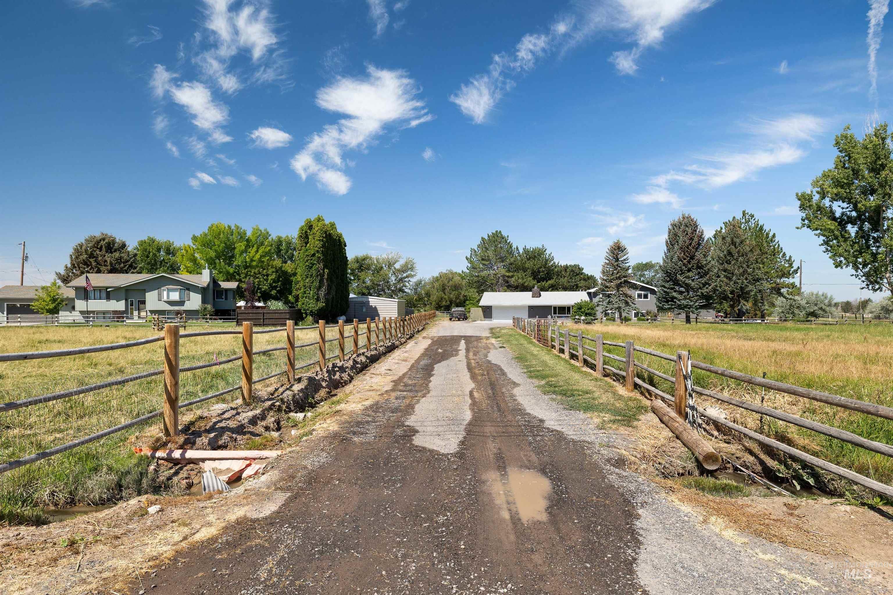 View of dirt / gravel road with a view of countryside