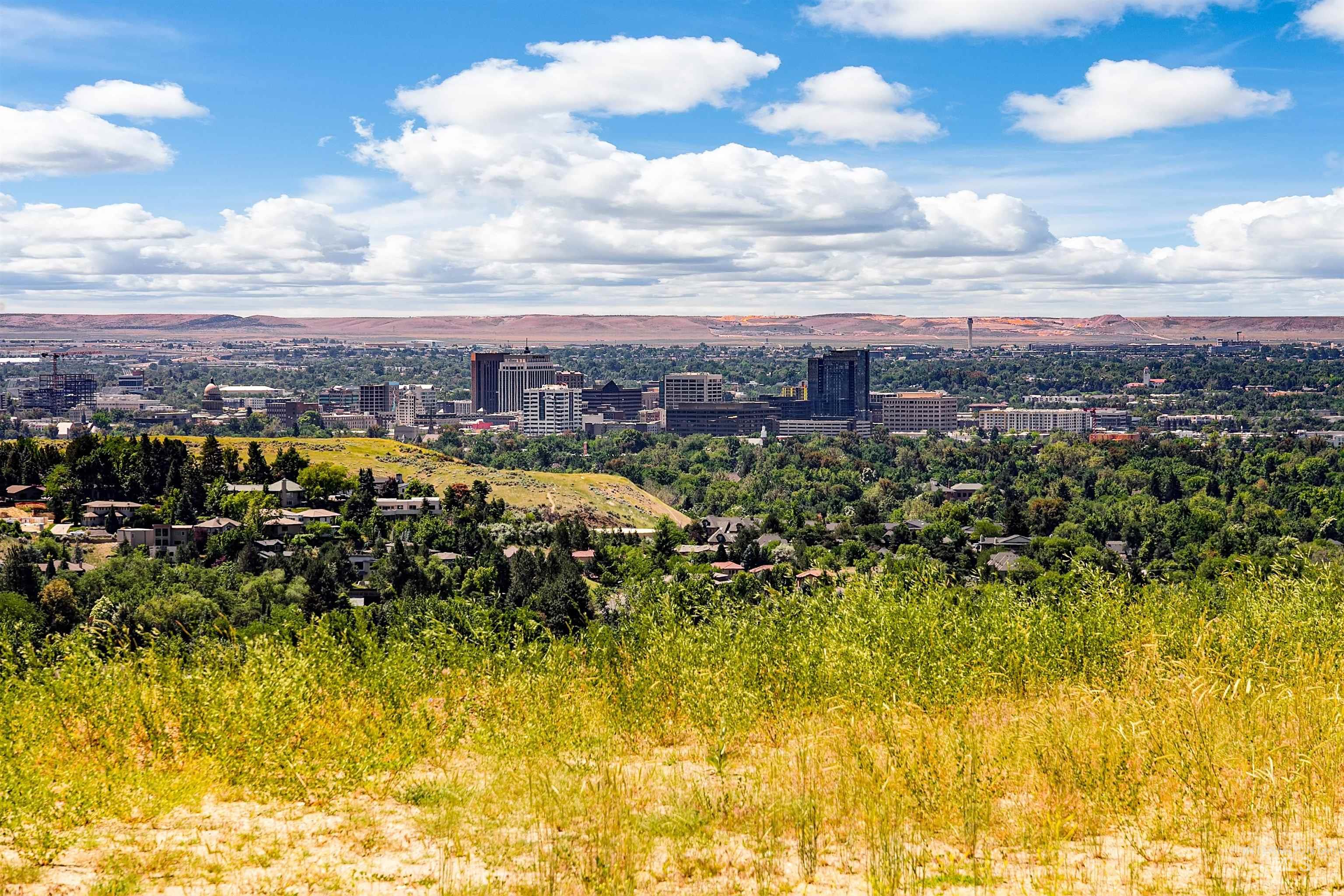 View of nature featuring a mountain backdrop and nearby urban area