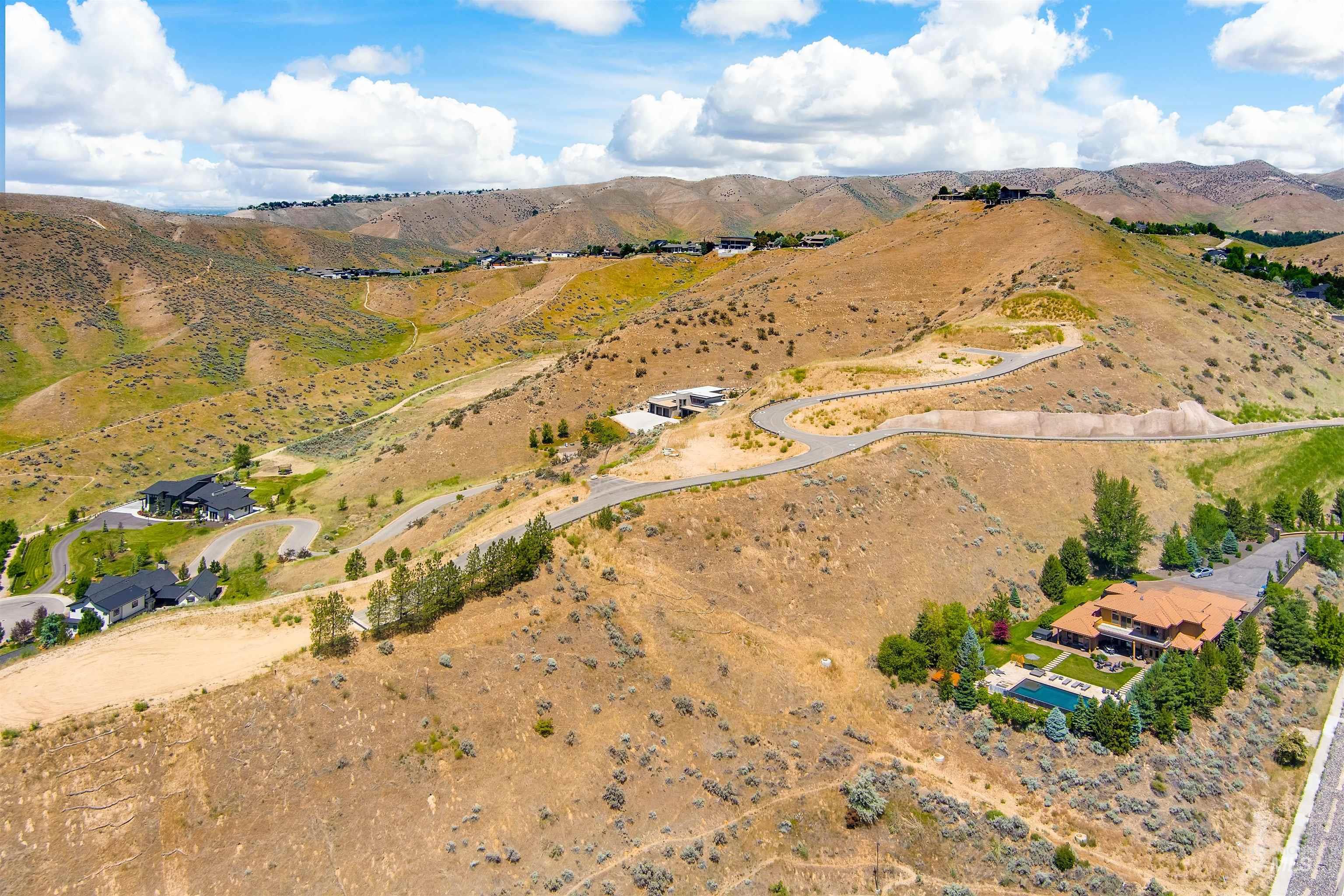 Aerial view of property's location with a mountainous background