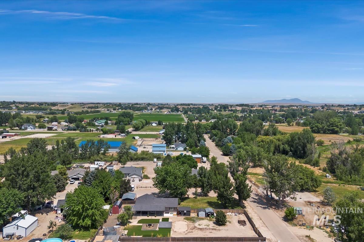 Aerial perspective of suburban area with a mountainous background
