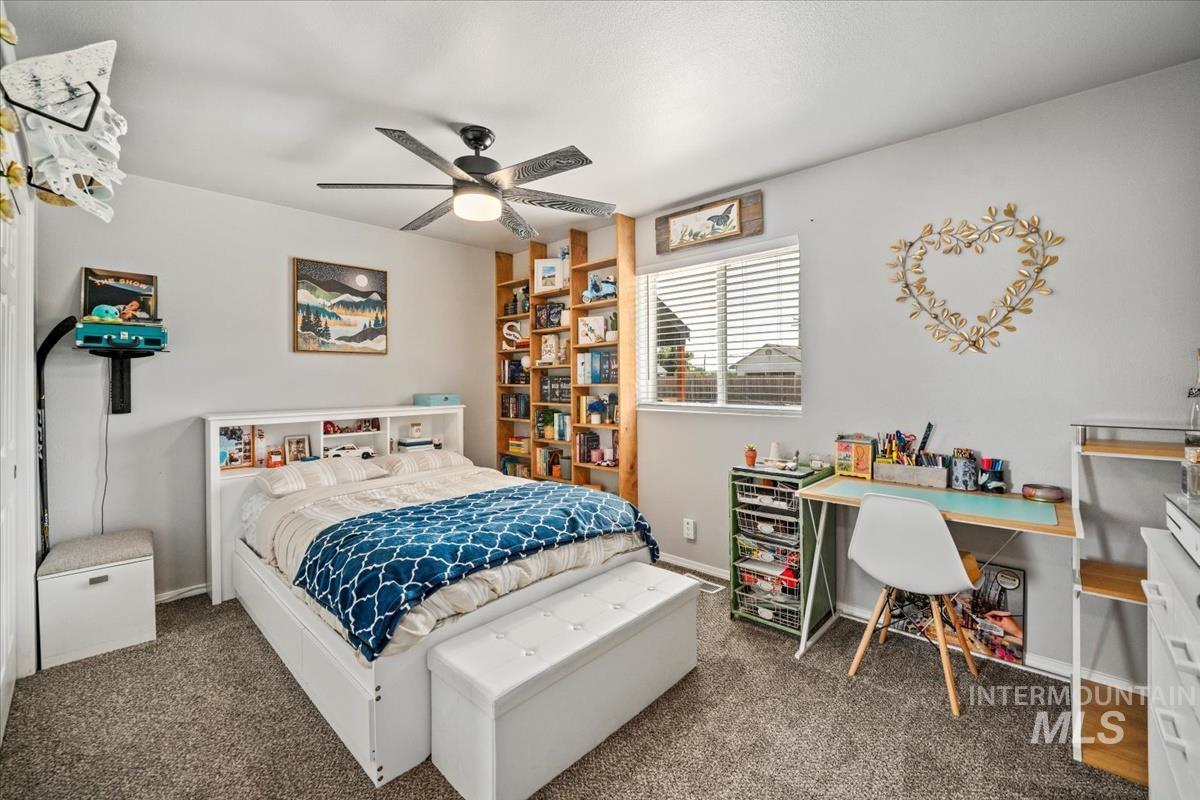 Bedroom featuring carpet flooring and ceiling fan