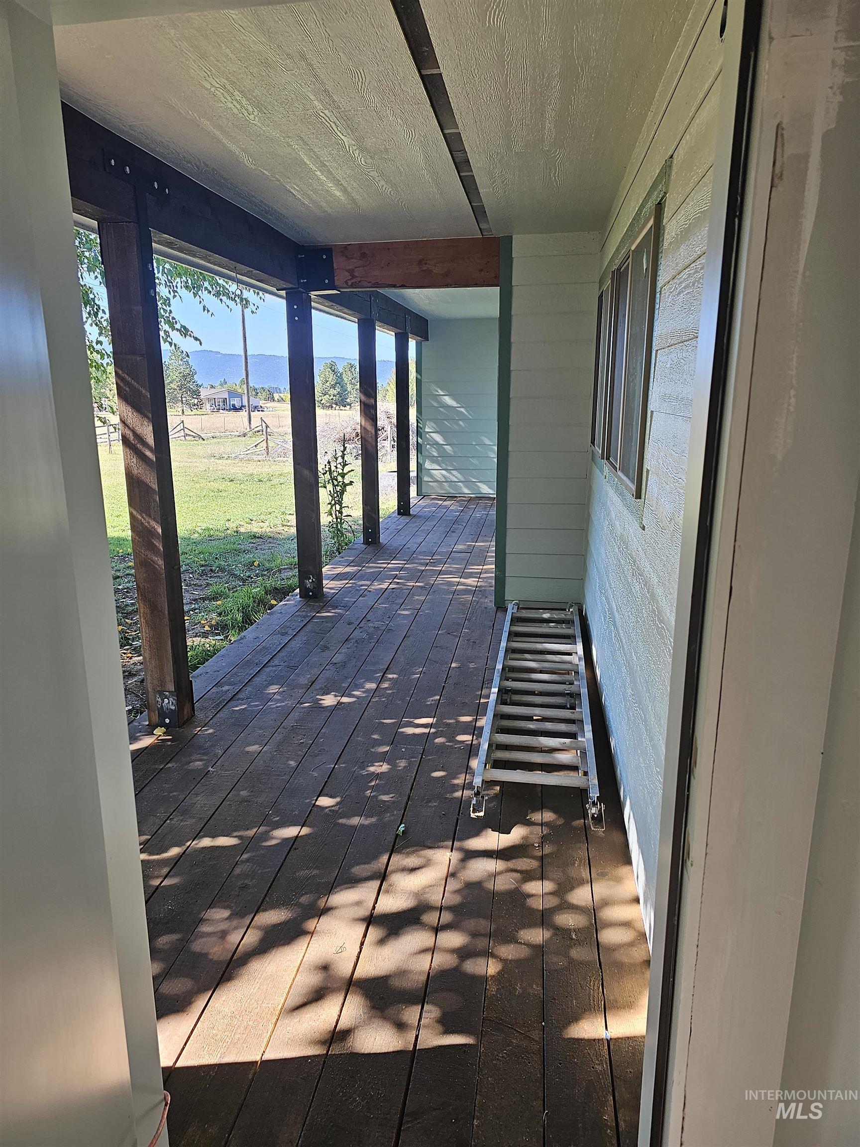 Deck featuring a yard