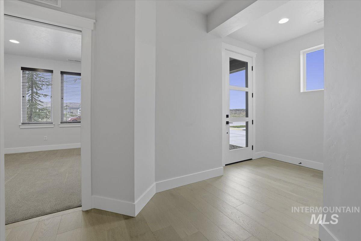 Interior space featuring recessed lighting, light wood finished floors, and healthy amount of natural light