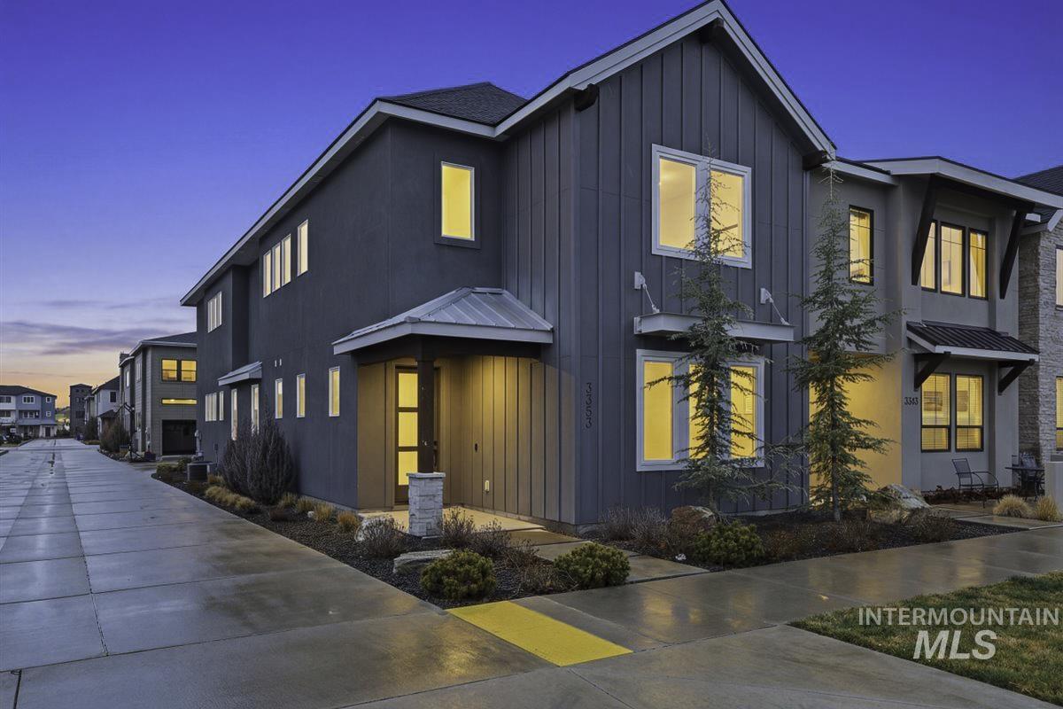 View of front of home featuring board and batten siding and a standing seam roof