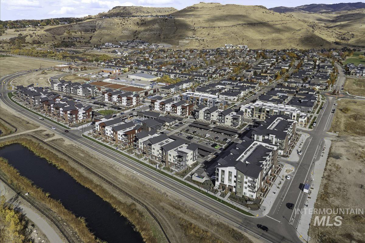 Aerial overview of property's location featuring a mountainous background