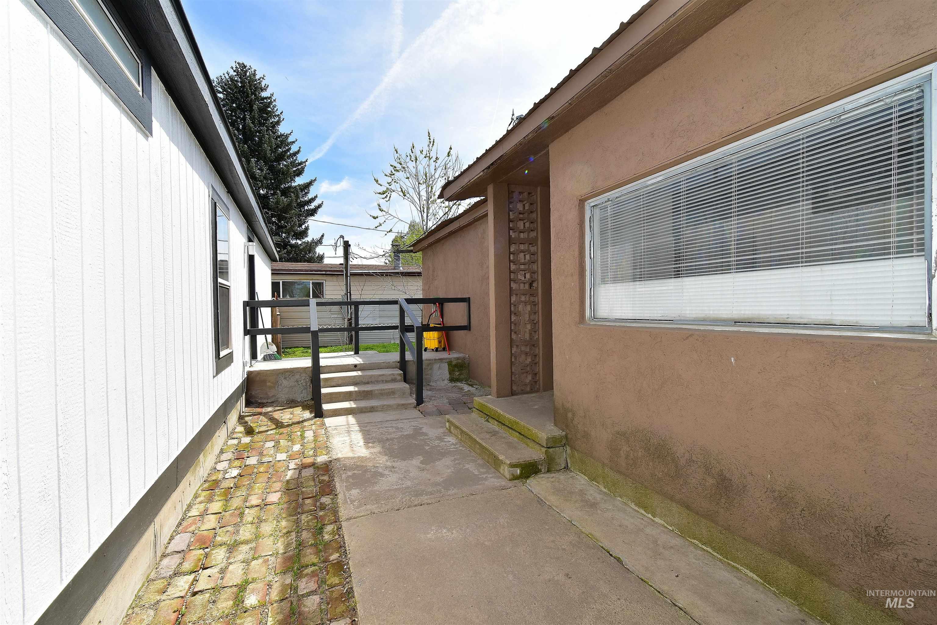 View of side of property featuring stucco siding