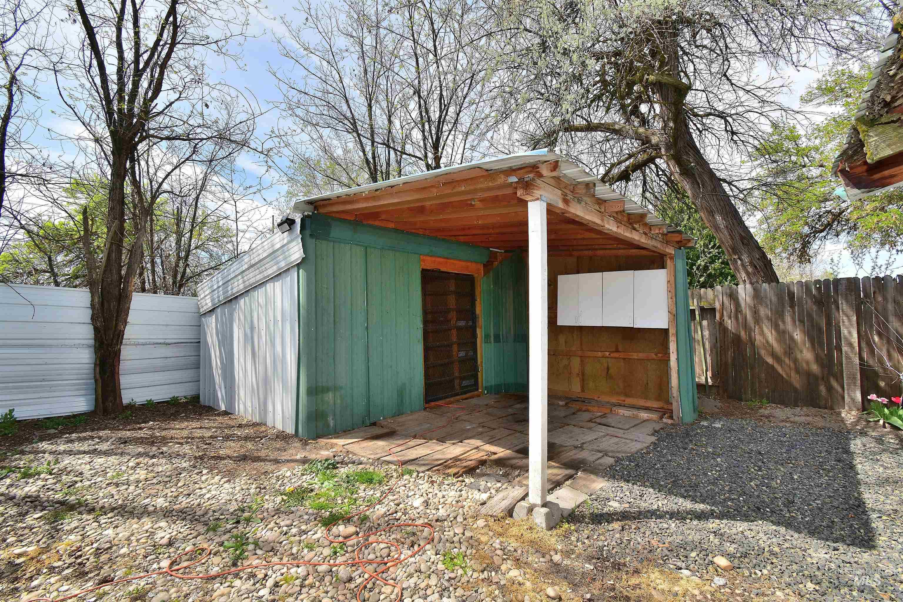 View of outdoor structure with a fenced backyard