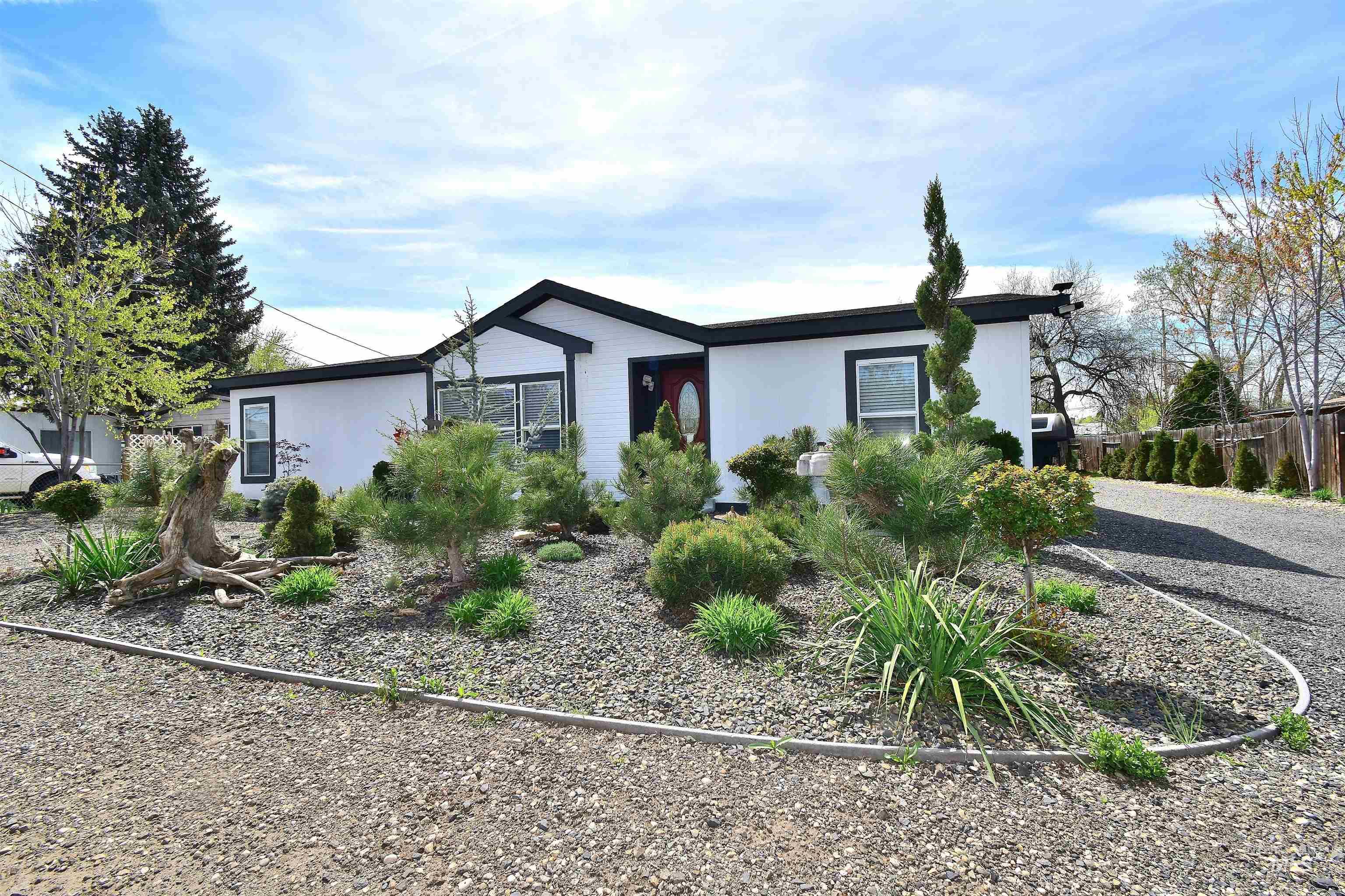 View of front facade featuring stucco siding