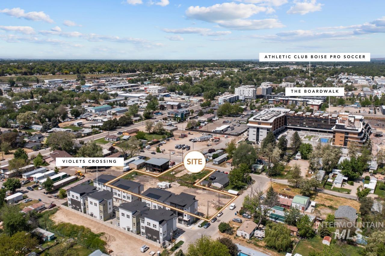 Aerial overview of property's location with nearby urban area