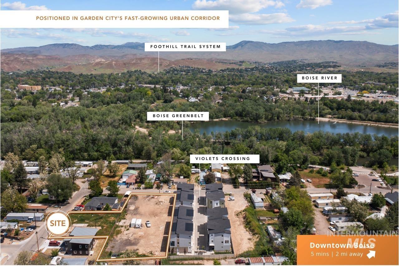 Aerial overview of property's location featuring a water and mountain view and nearby suburban area