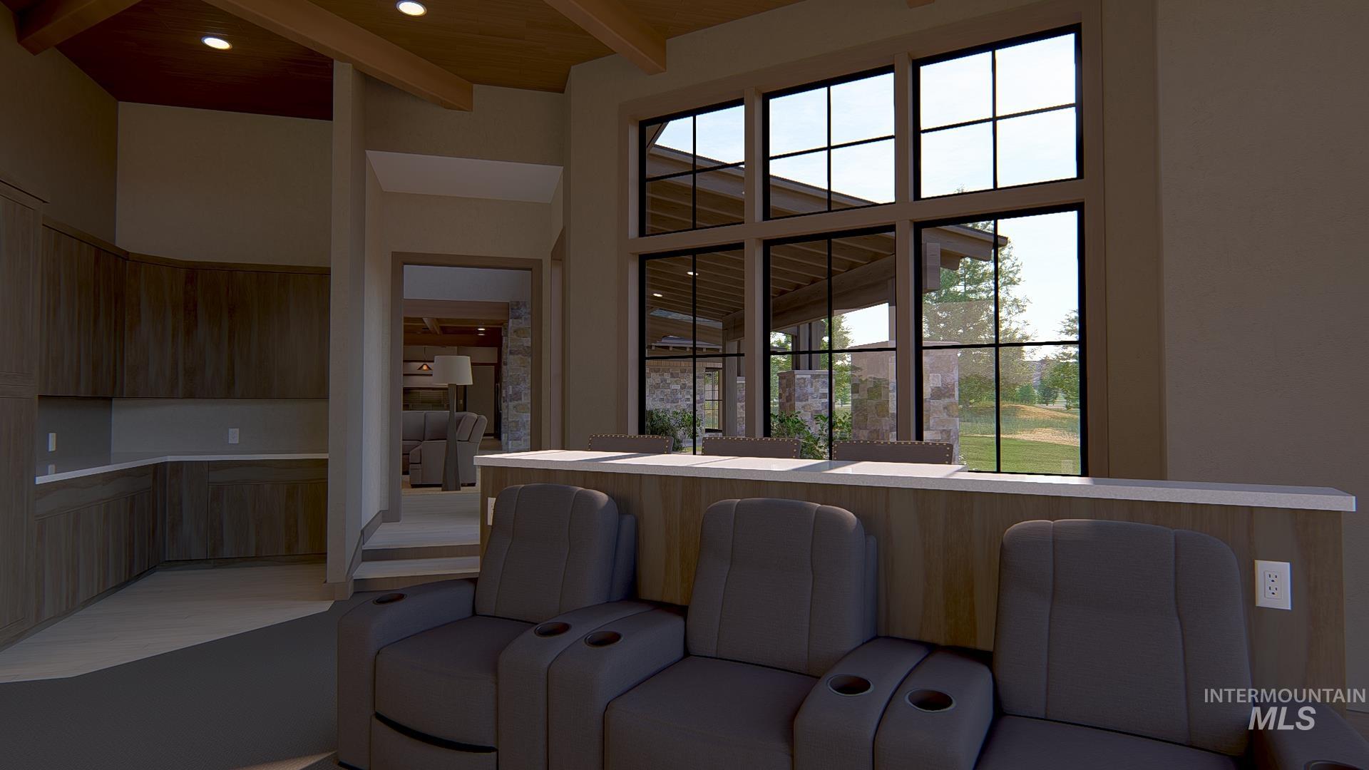 Kitchen with open floor plan, modern cabinets, beamed ceiling, plenty of natural light, and a high ceiling