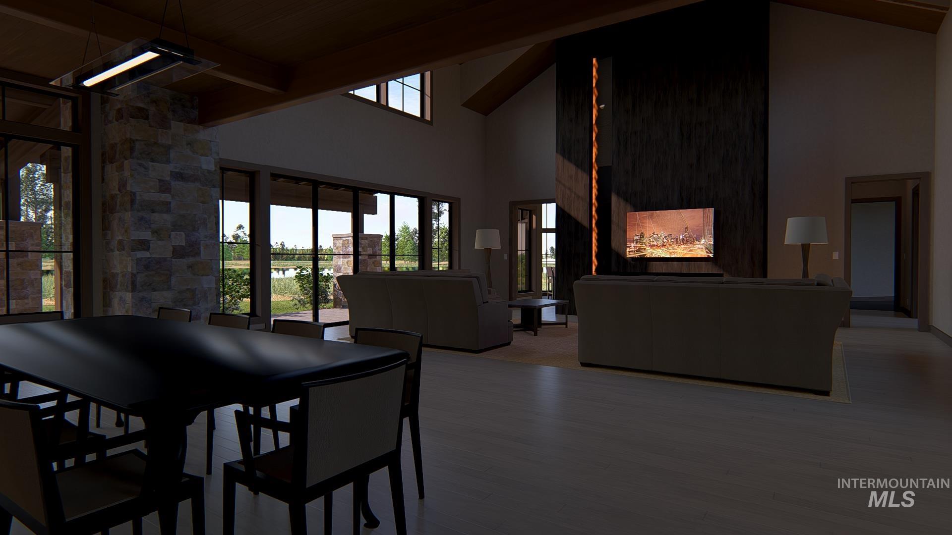 Dining room with high vaulted ceiling, wood finished floors, and beamed ceiling
