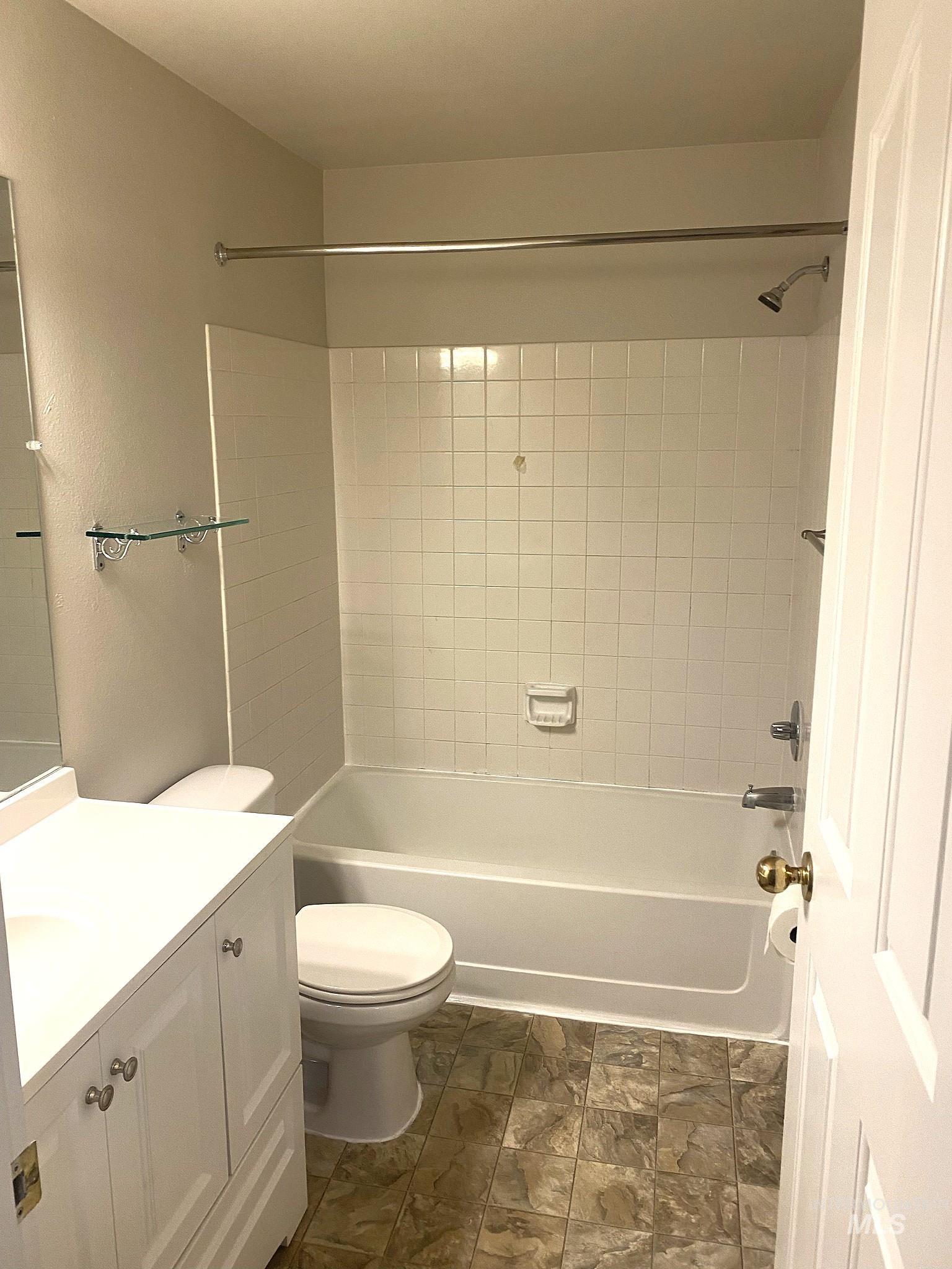 Bathroom with shower / bathtub combination and vanity