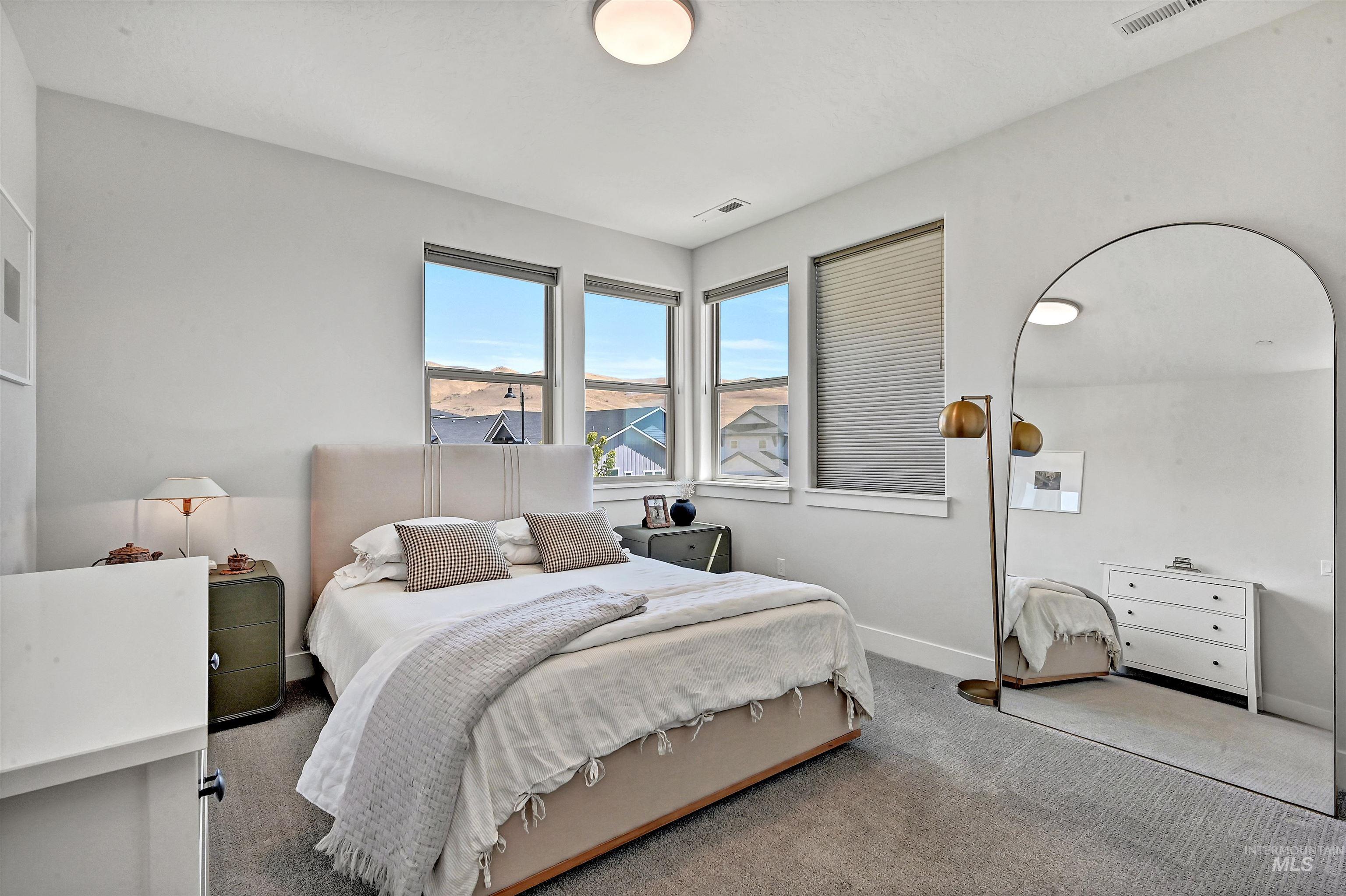 Carpeted bedroom with baseboards