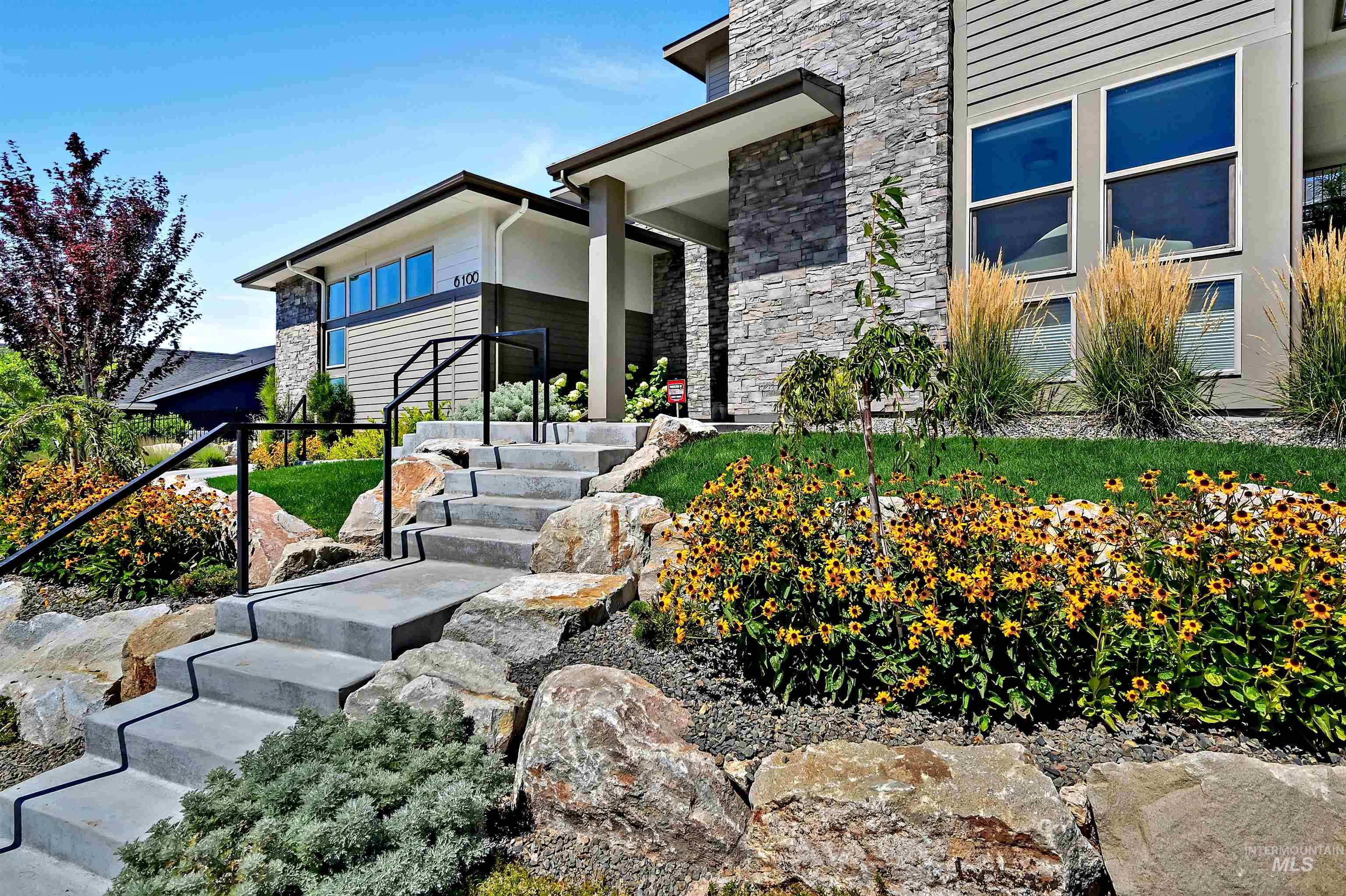Doorway to property featuring stone siding