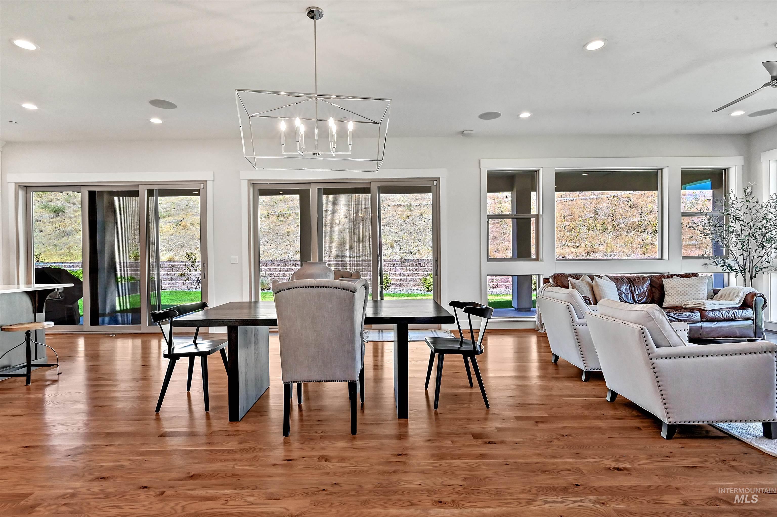 Dining room featuring light wood-style flooring, recessed lighting, and a chandelier