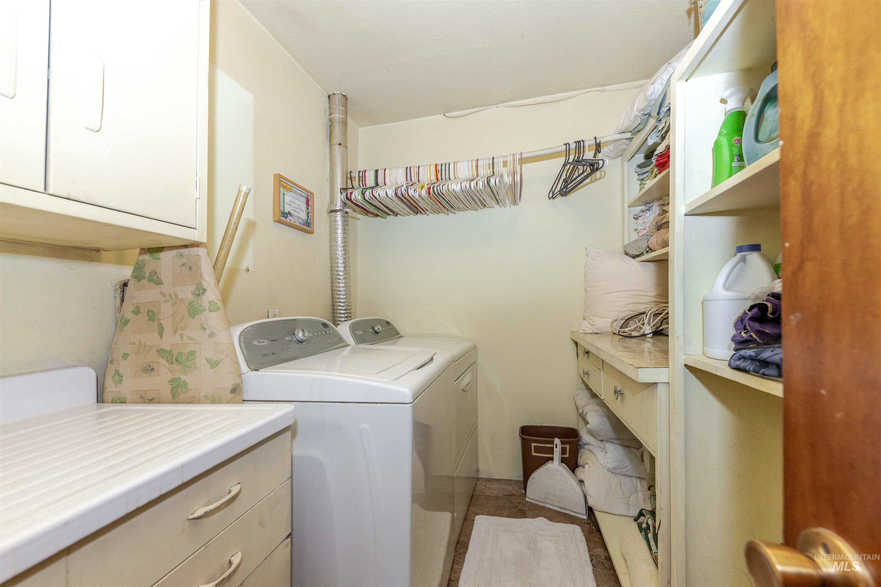 Laundry room with washing machine and clothes dryer Old sink needs repaired or replaced