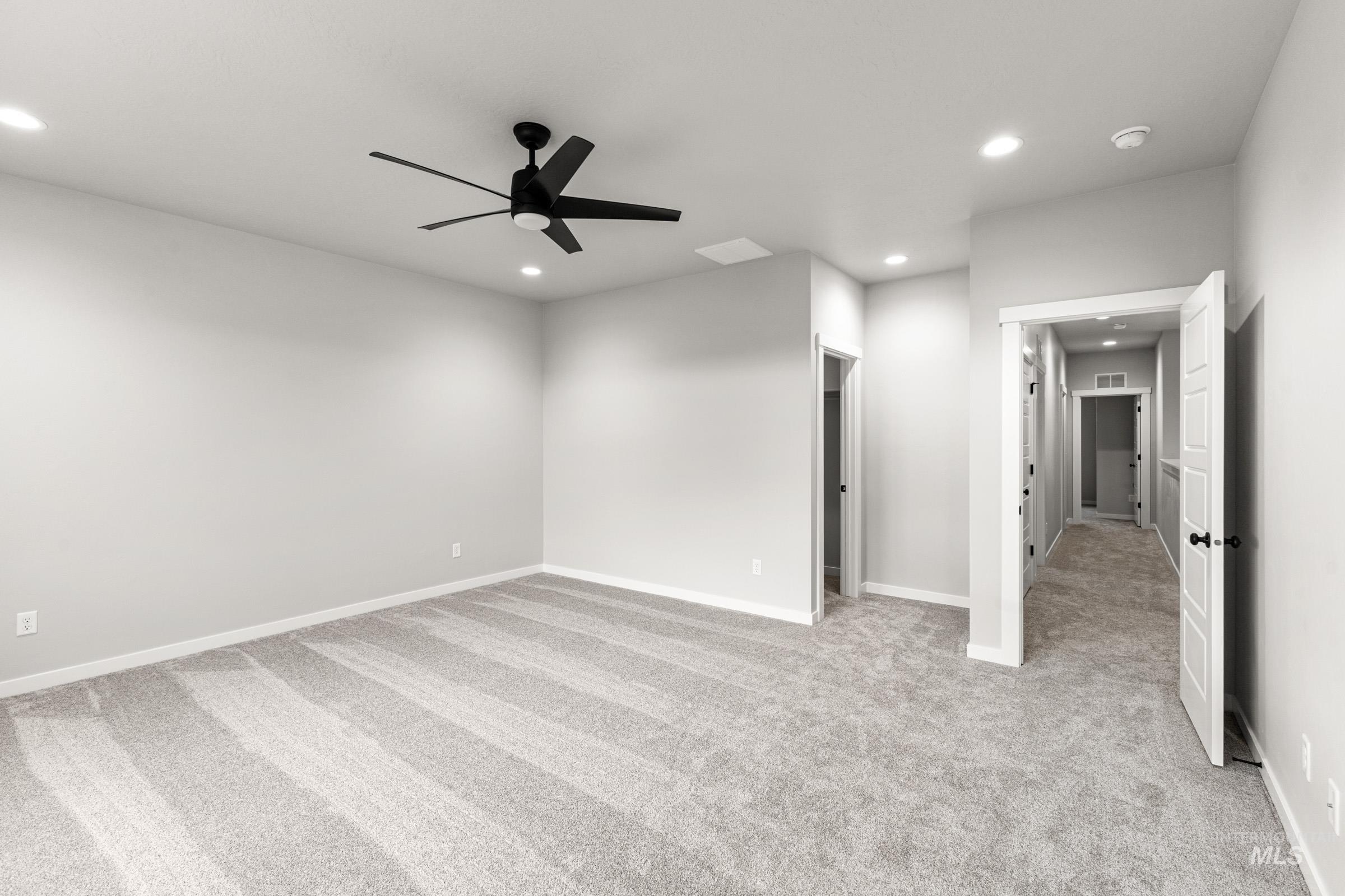 Unfurnished room with light colored carpet, ceiling fan, and recessed lighting