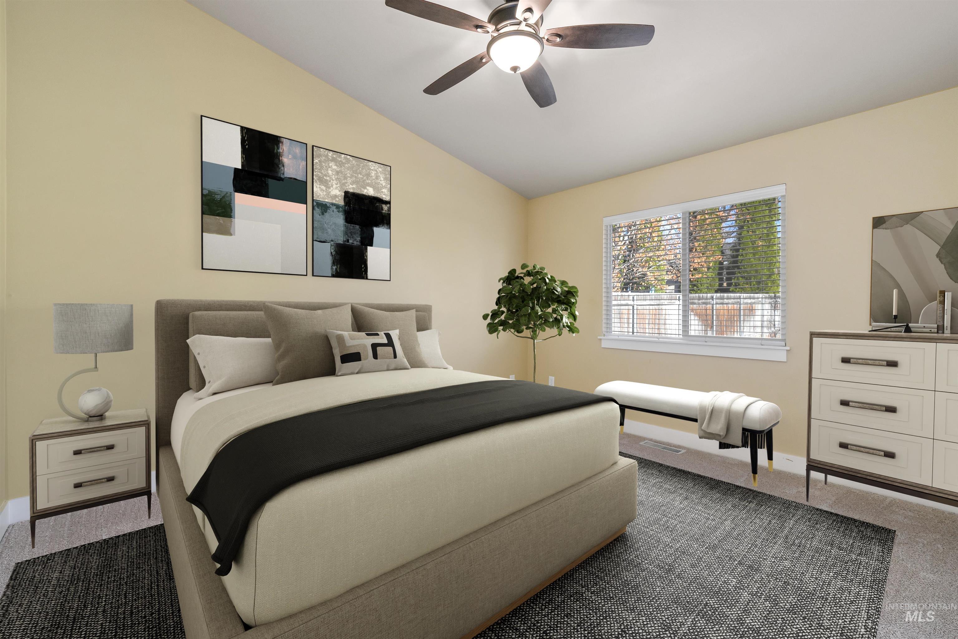 Bedroom with new carpet, vaulted ceiling, and ceiling fan