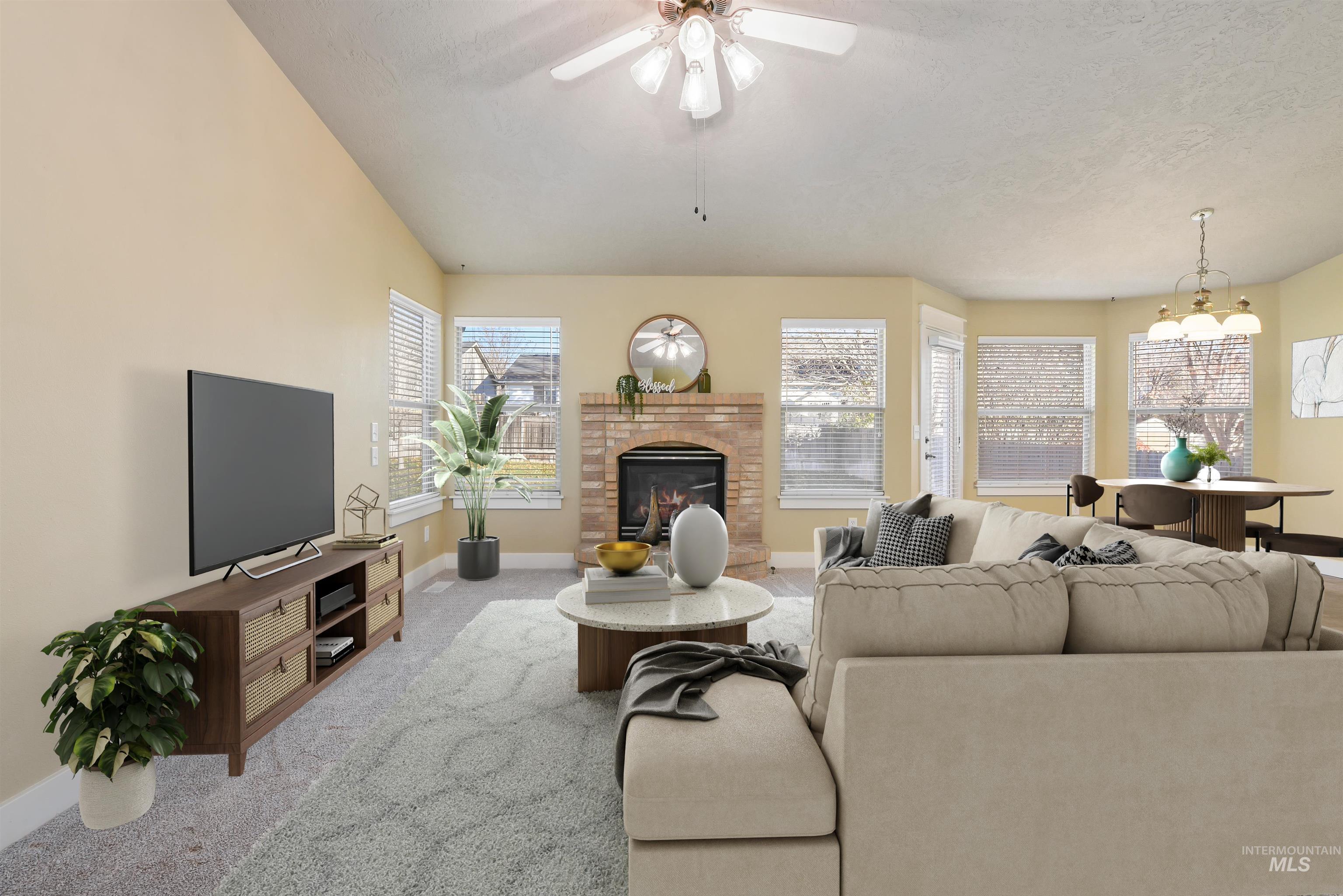 Virtually Staged - Living area featuring light new carpet, brick fireplace, and a vaulted ceiling