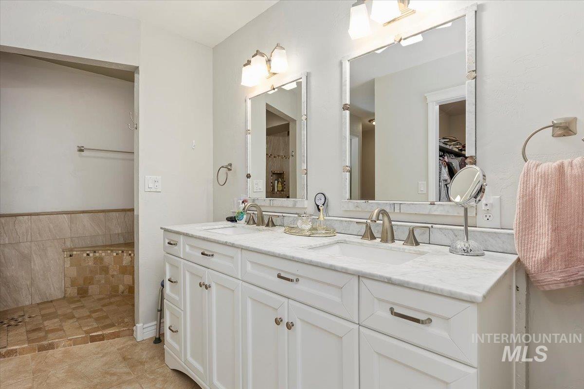 Bathroom featuring double vanity