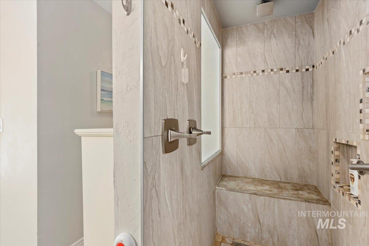 Bathroom with a tile shower