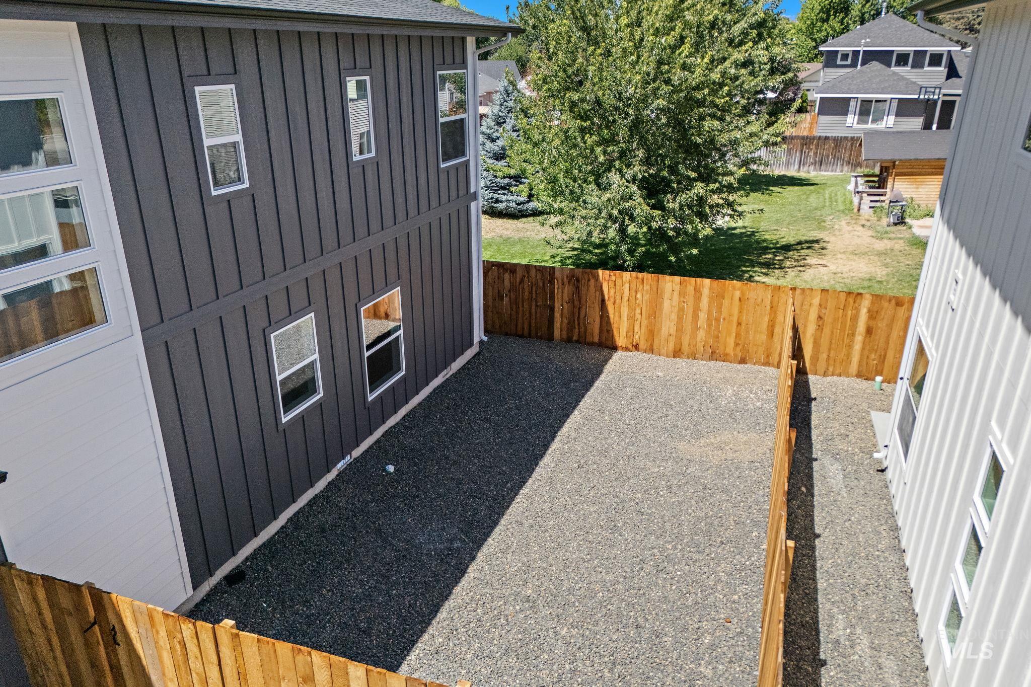 View of fenced backyard