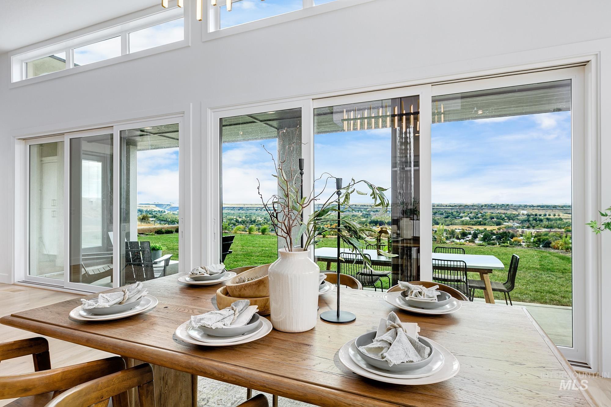 Expansive sliding glass doors open to an outdoor space