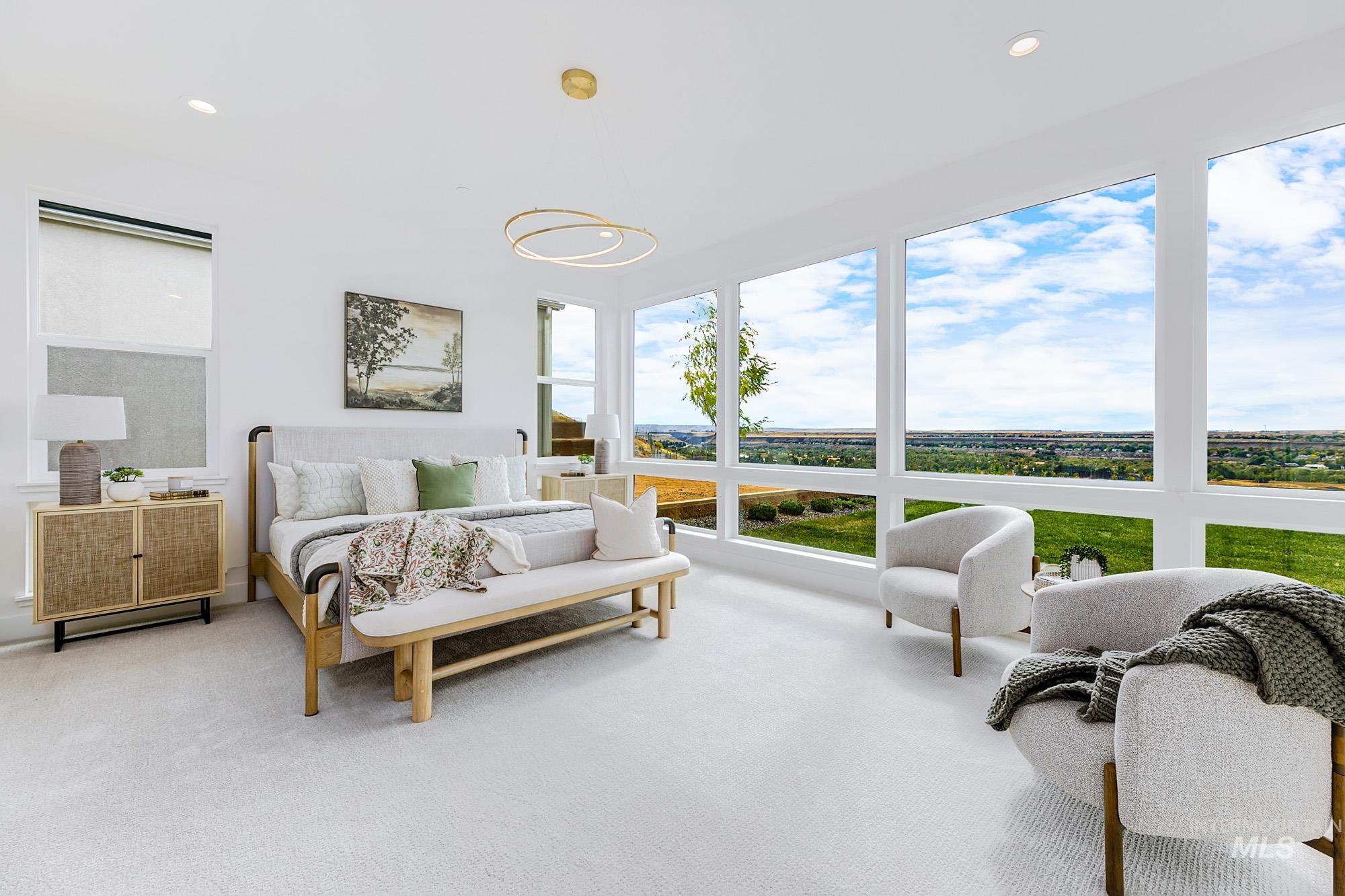 Expansive window wall with wide landscape, recessed lighting, and a contemporary ceiling fixture