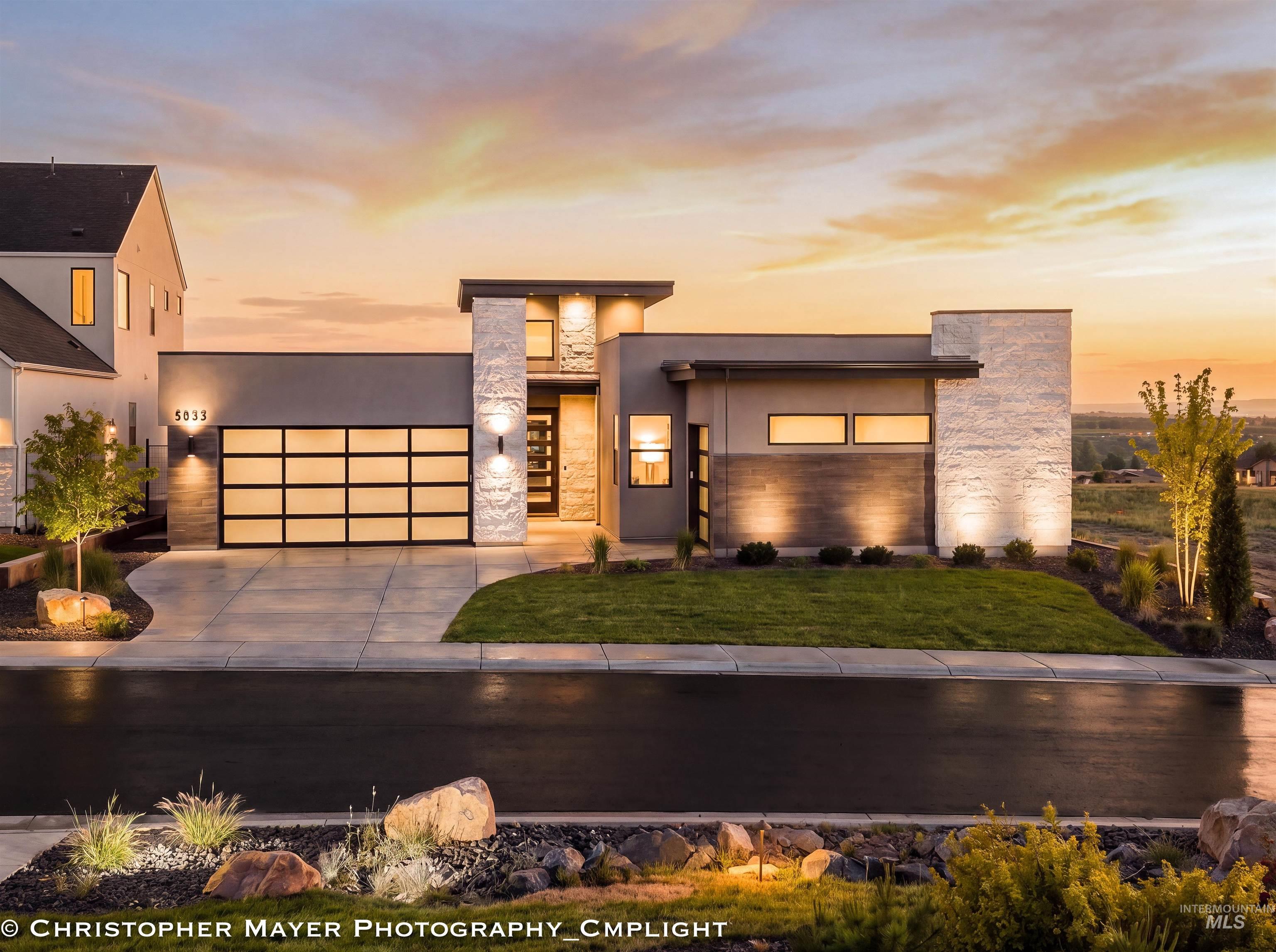 Contemporary architectural design featuring stucco and stone-clad exterior elements