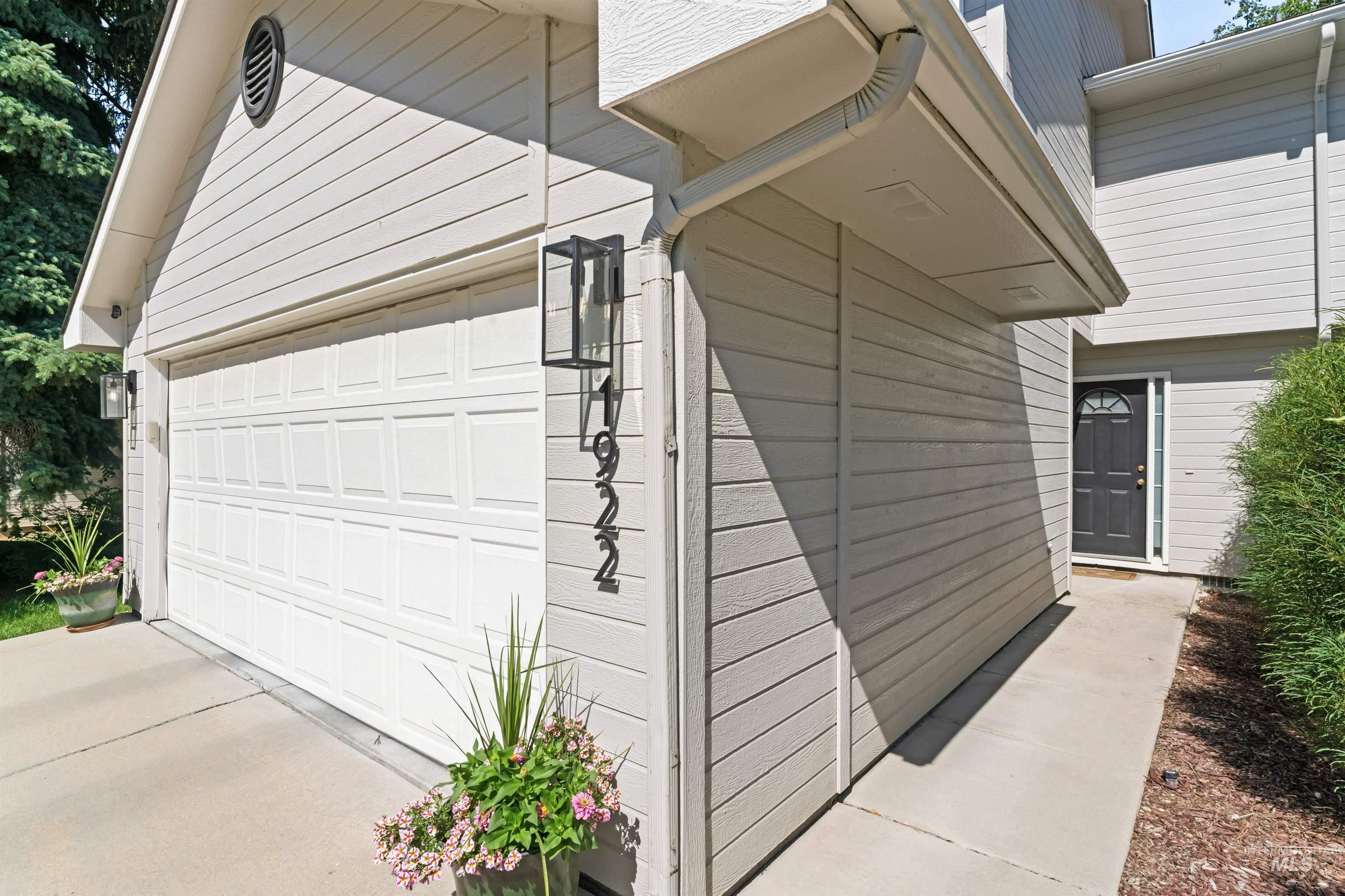 View of side of home with driveway
