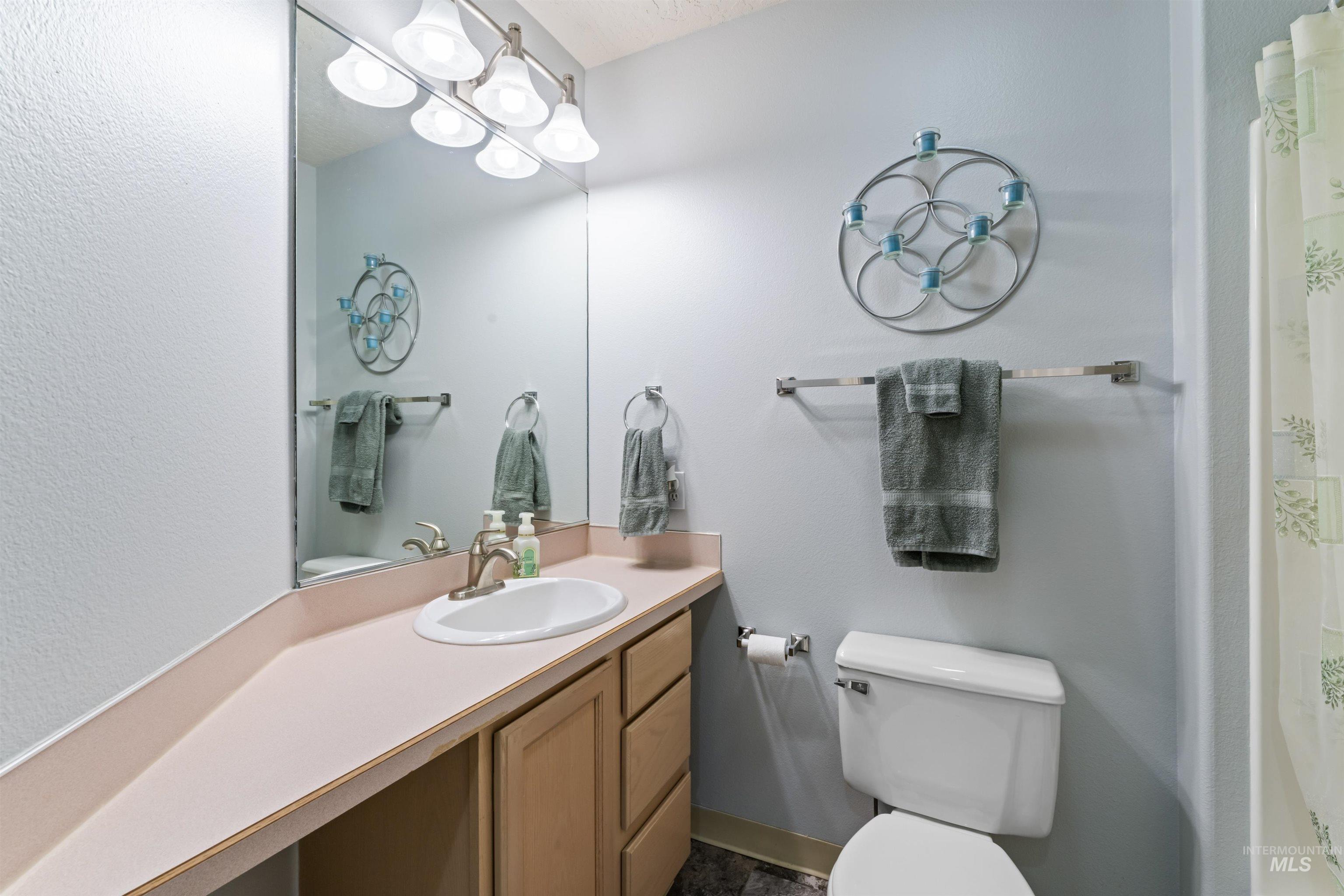 Bathroom with vanity and a shower with shower curtain