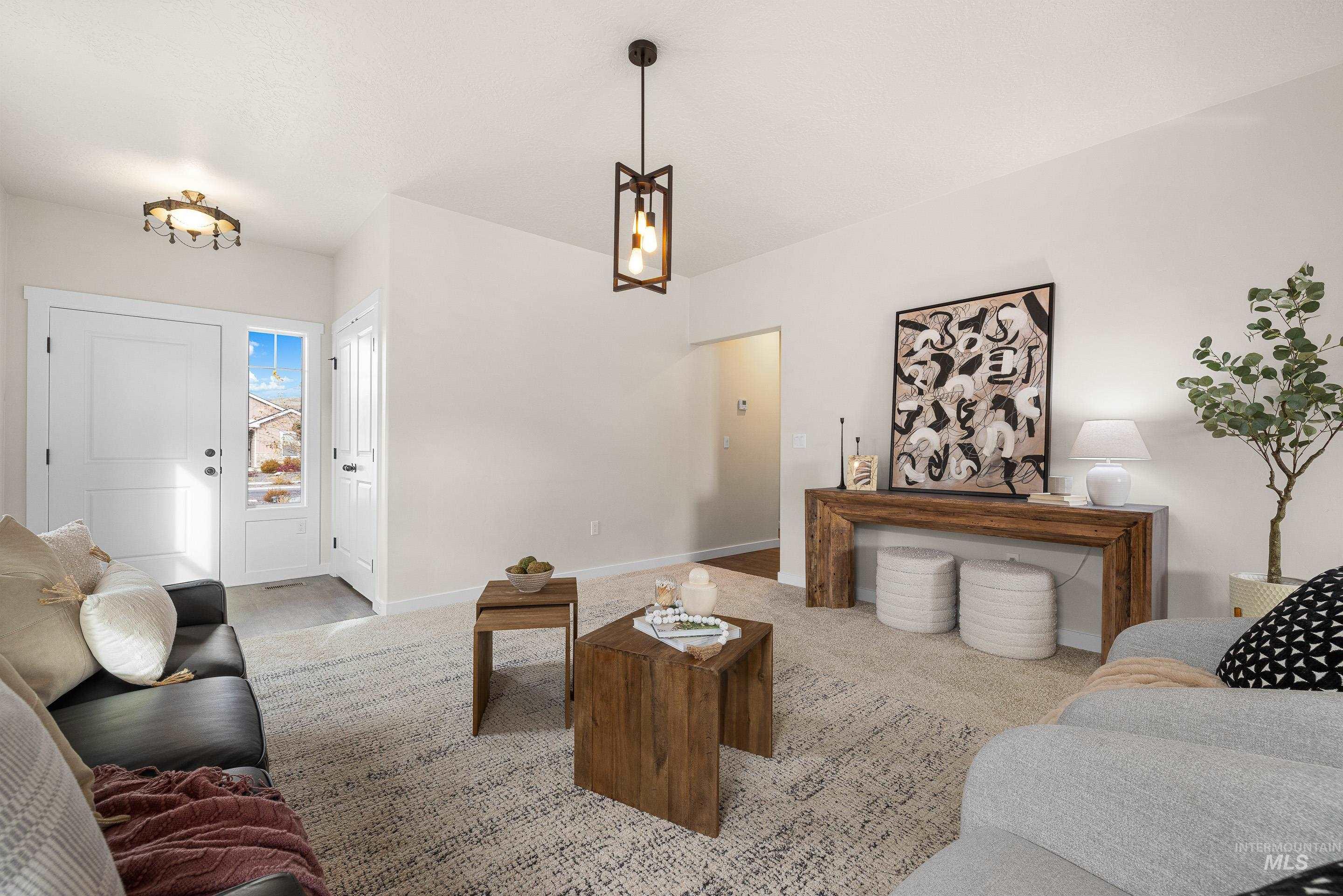 Living area with carpet and baseboards