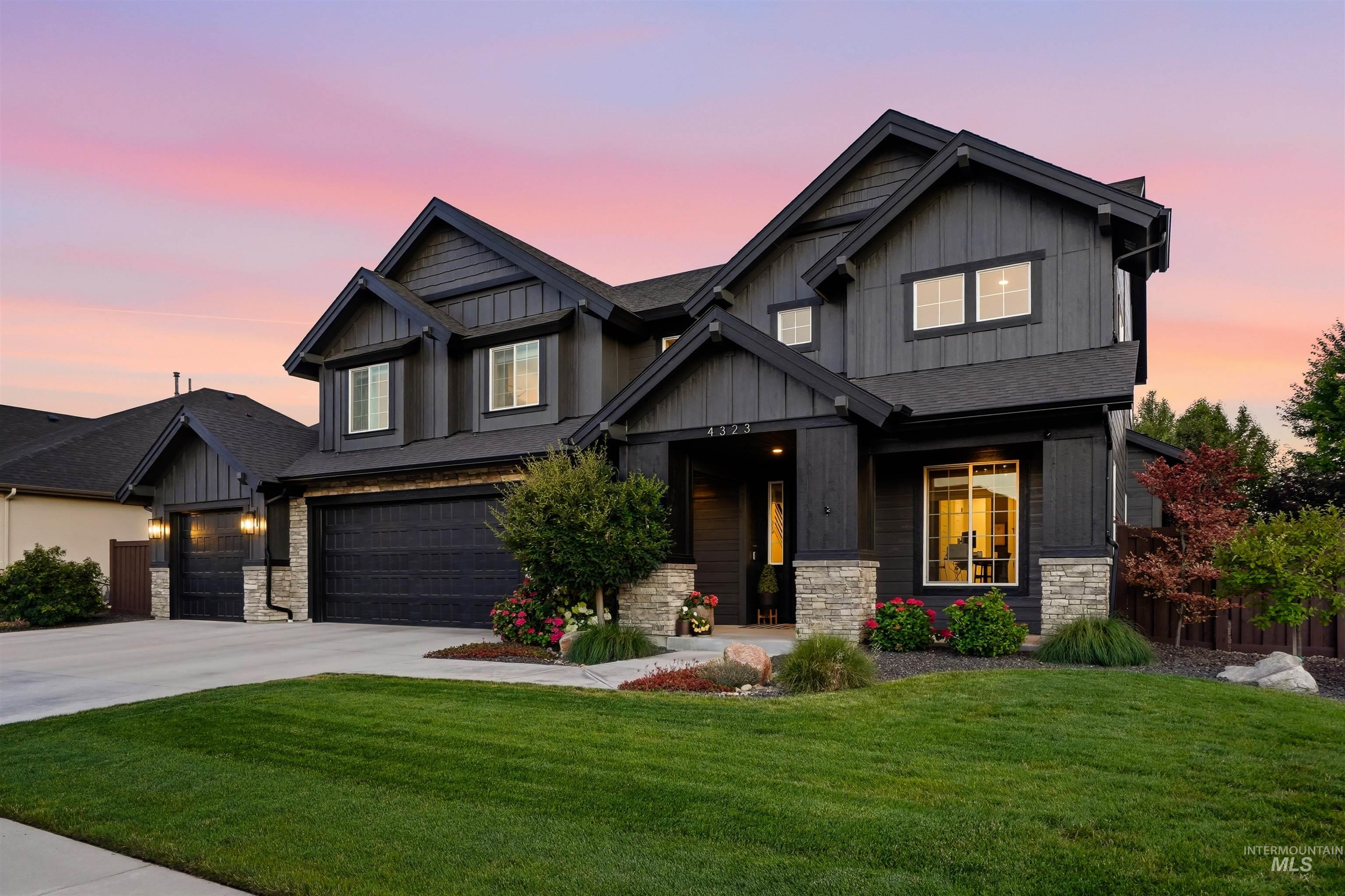Contemporary exterior featuring dark horizontal siding and vertical board and batten accents