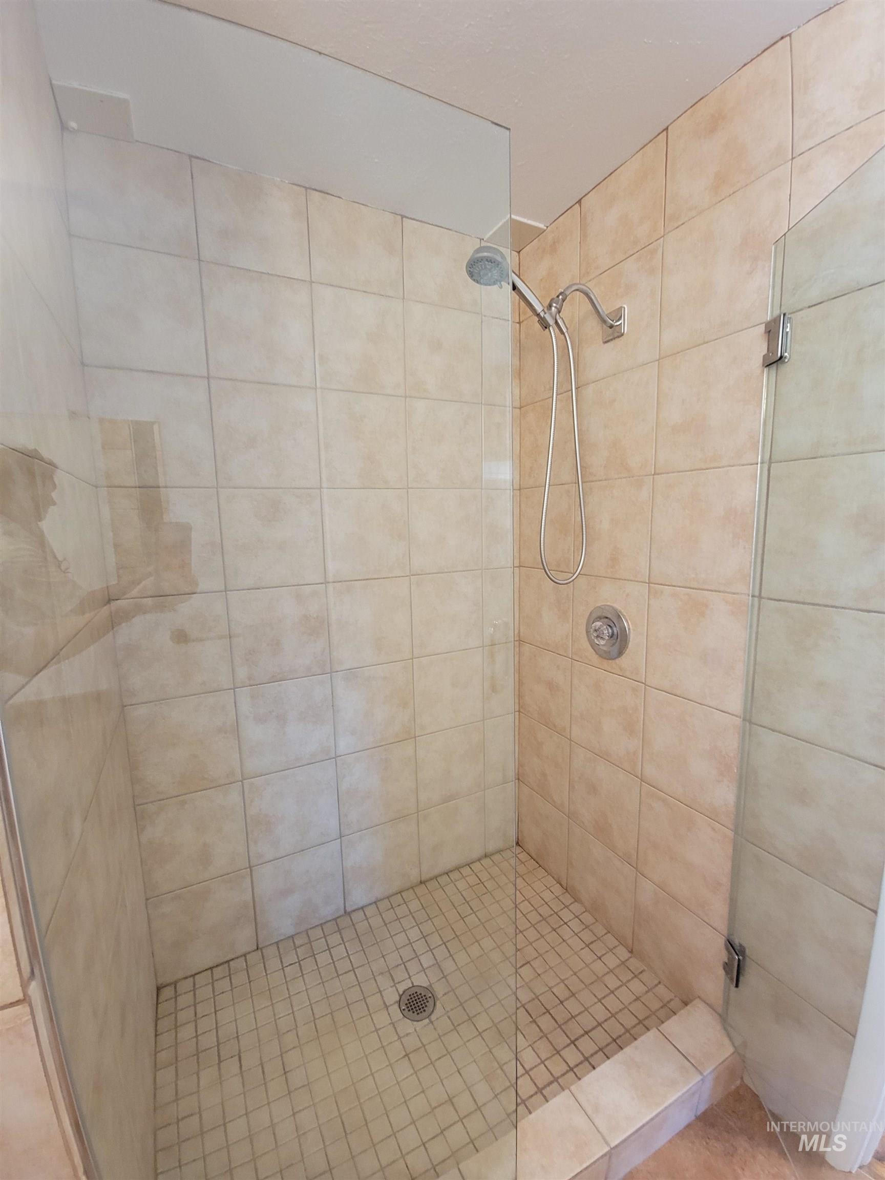 Bathroom featuring a shower stall