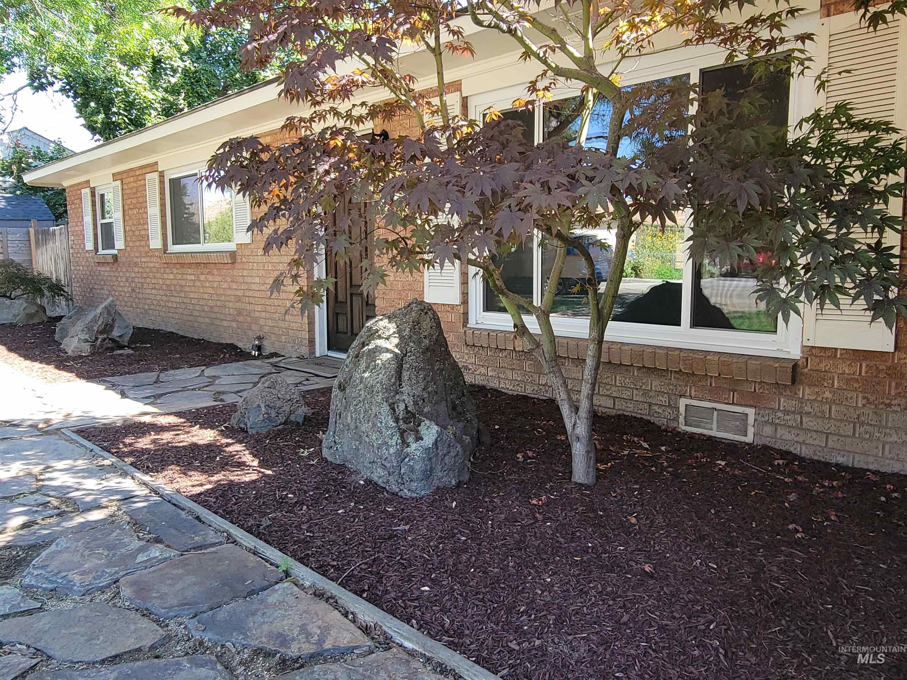 View of home's exterior featuring brick siding