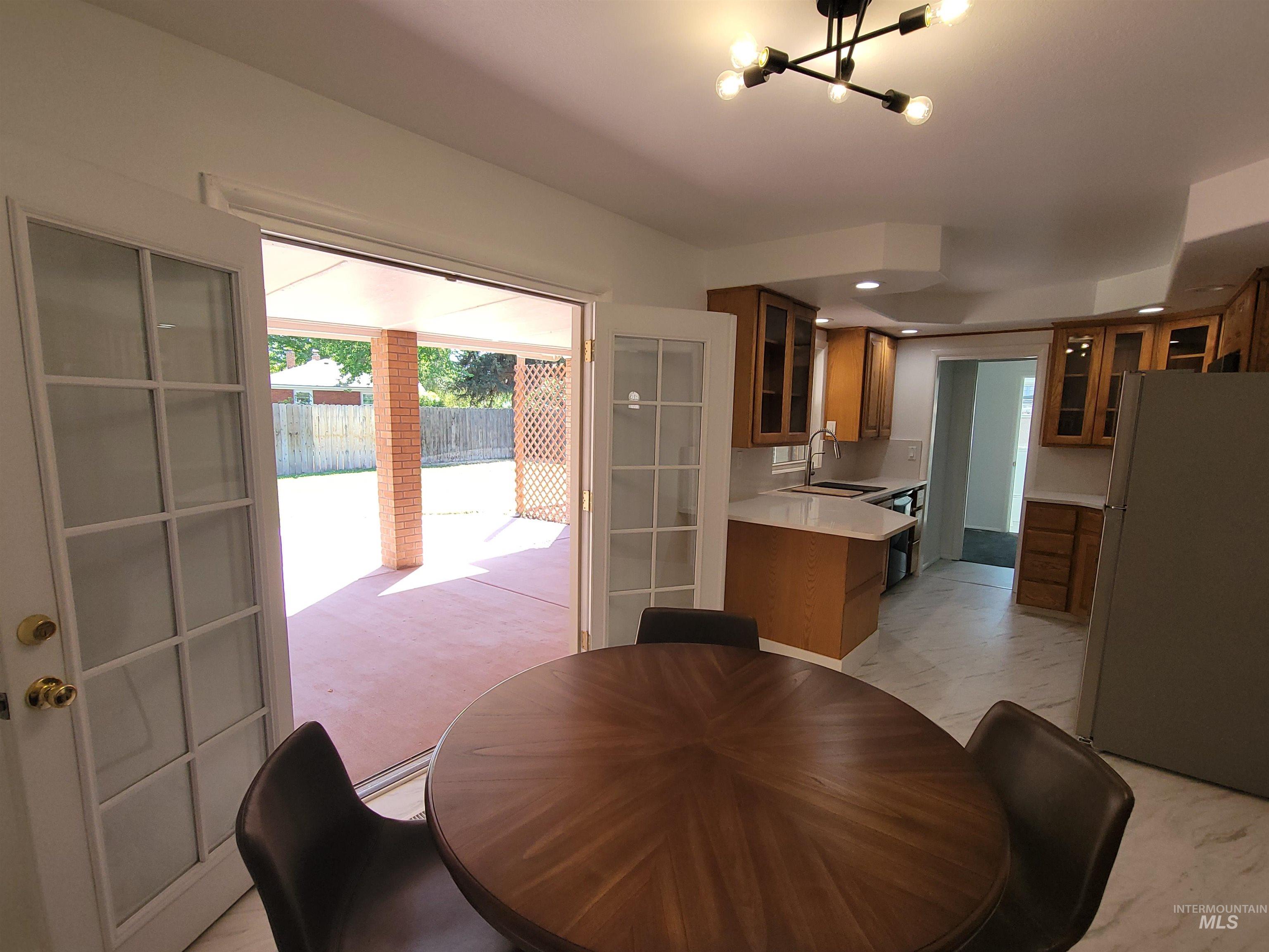 Dining space featuring a chandelier and recessed lighting