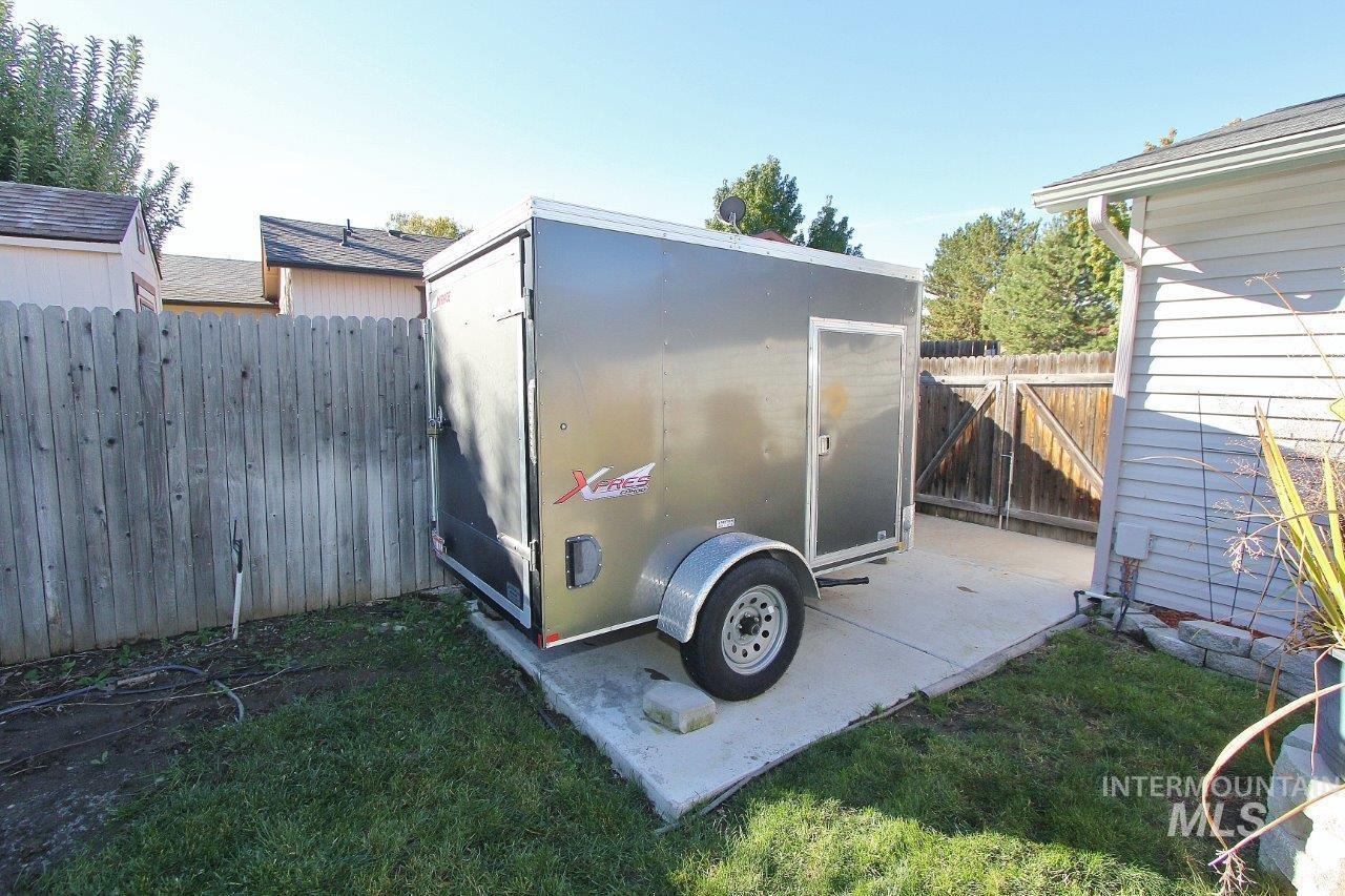 View of outdoor structure with a fenced backyard