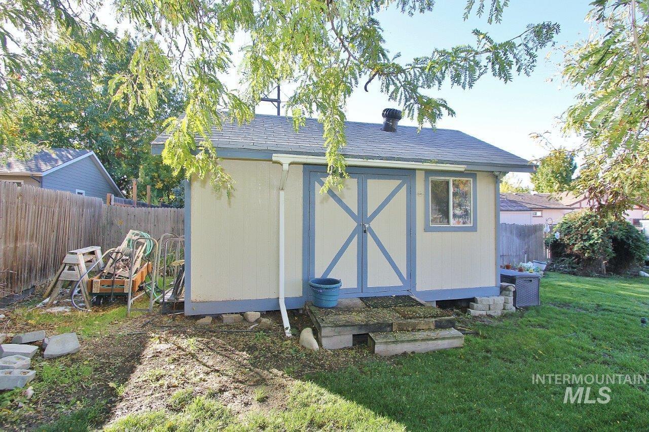 View of shed with a fenced backyard
