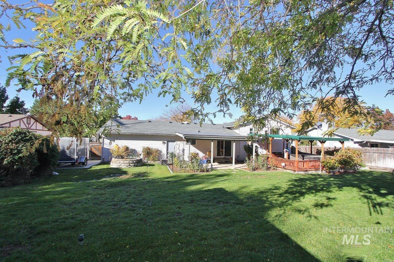 Rear view of house featuring a patio