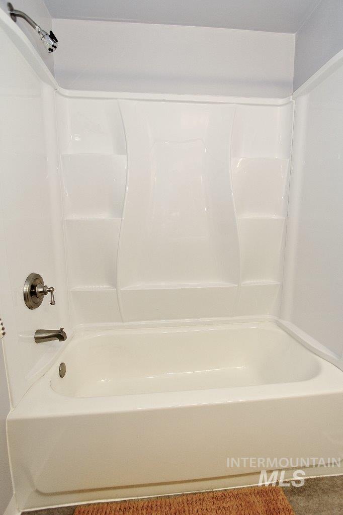 Full bathroom with shower / washtub combination