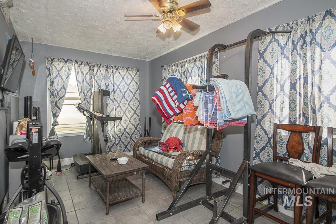 Interior space with ceiling fan and an outdoor living space